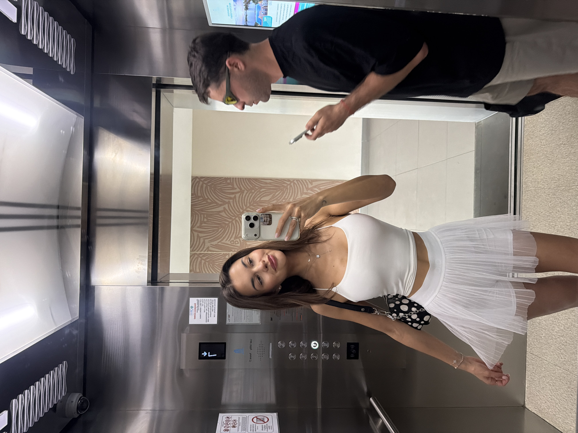 Woman takes elevator selfie in Choeng Thale, Thailand