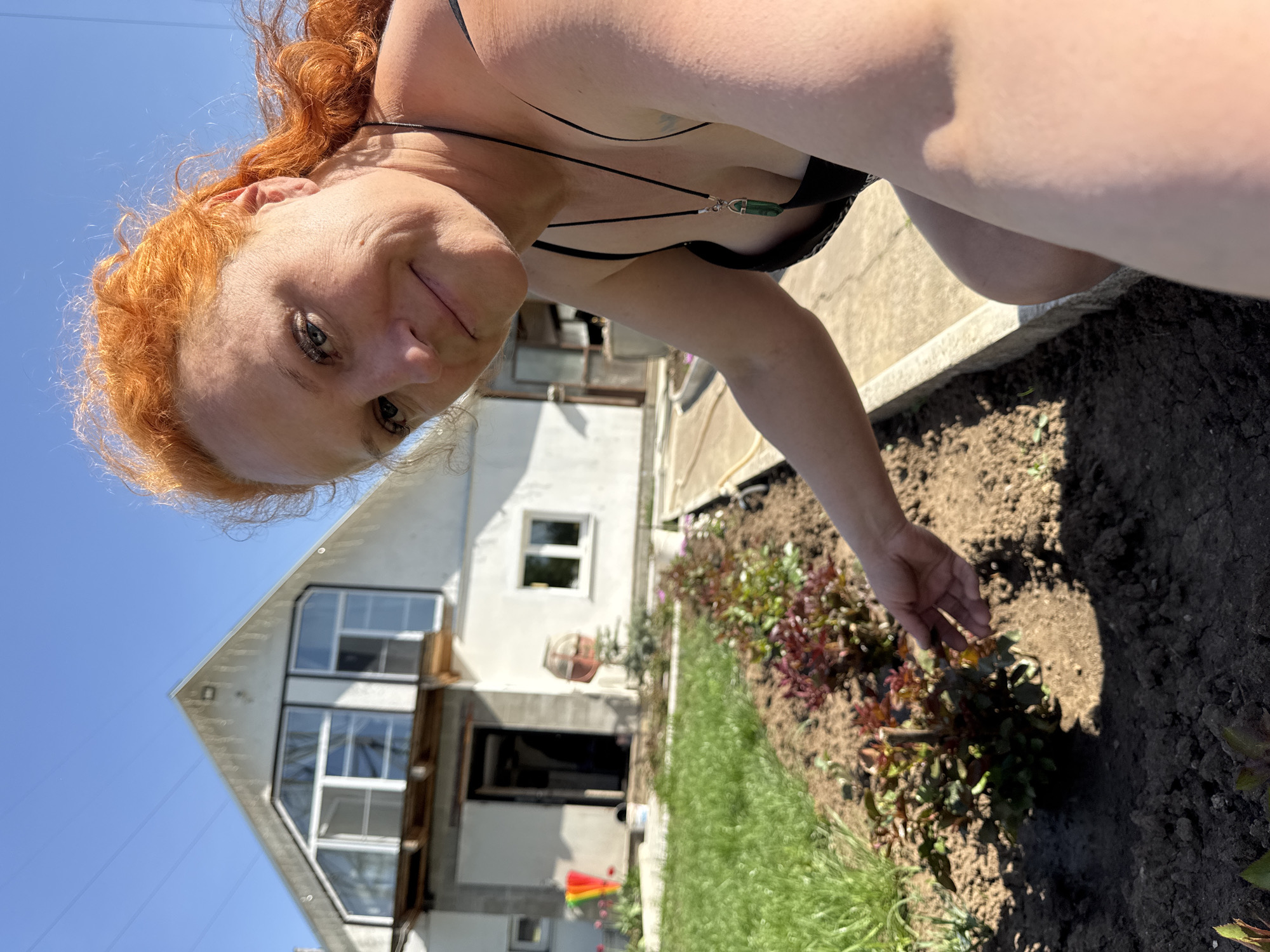 Woman gardens, snacks with dog in Chaikovsky, Russia