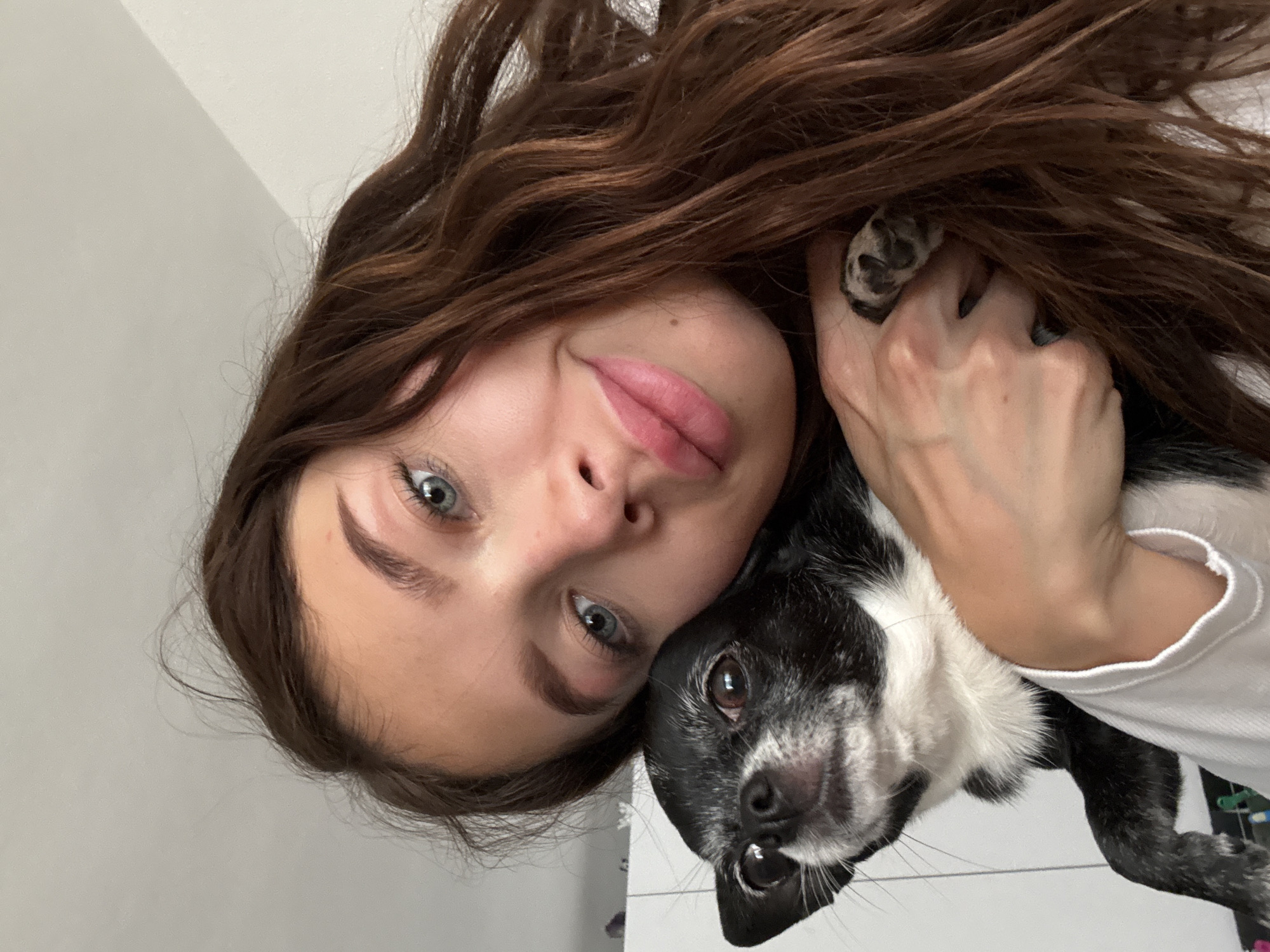 Woman poses with small dog in Ramat Gan