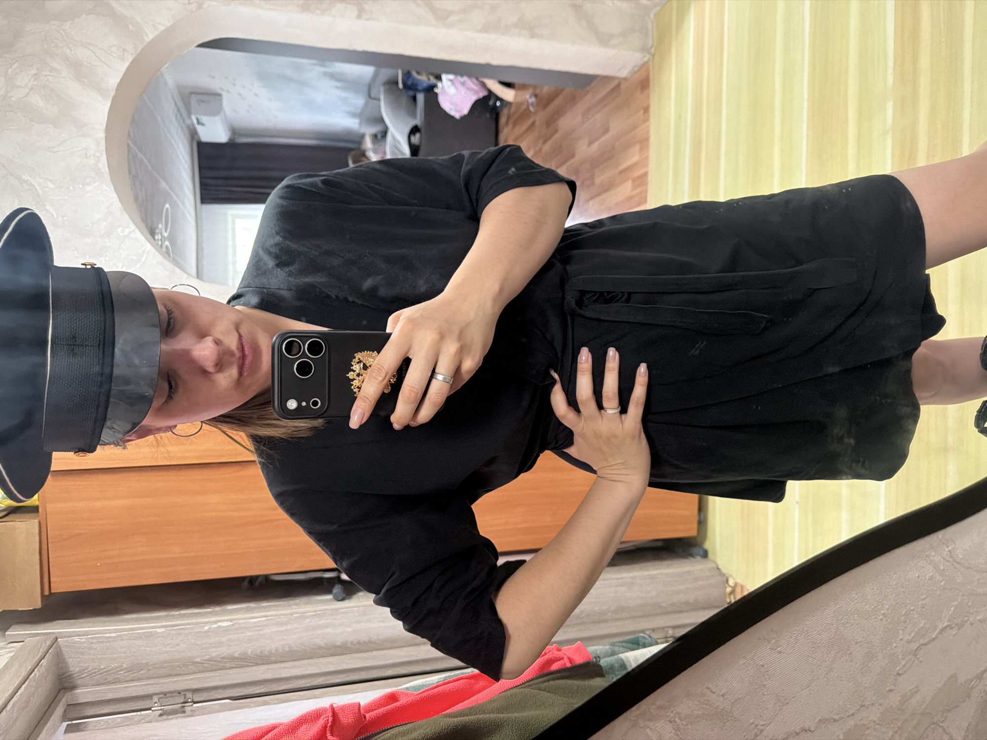Woman Takes Multiple Mirror Selfies in Sergeyevka Home