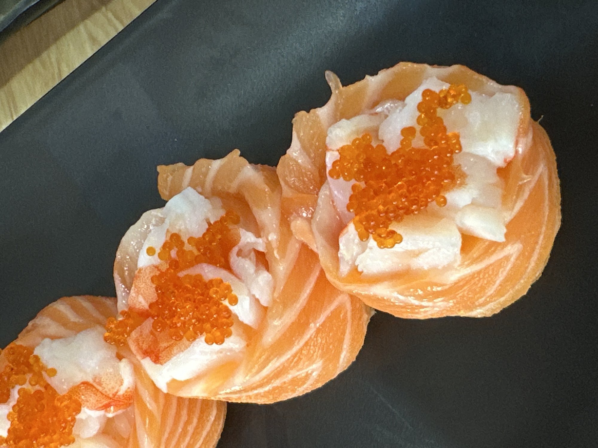 Salmon sushi and salad spread at a Nha Trang restaurant