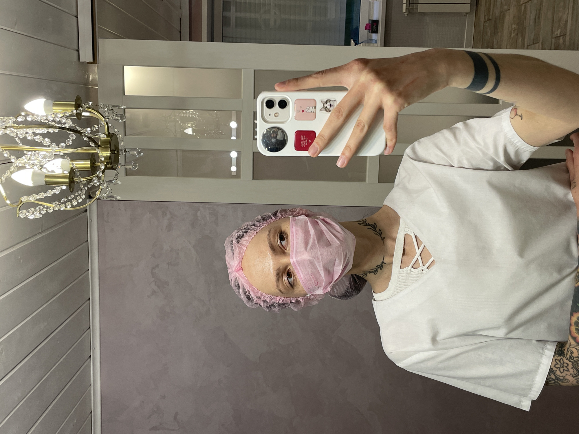 Medical worker takes mirror selfie in Izhevsk room