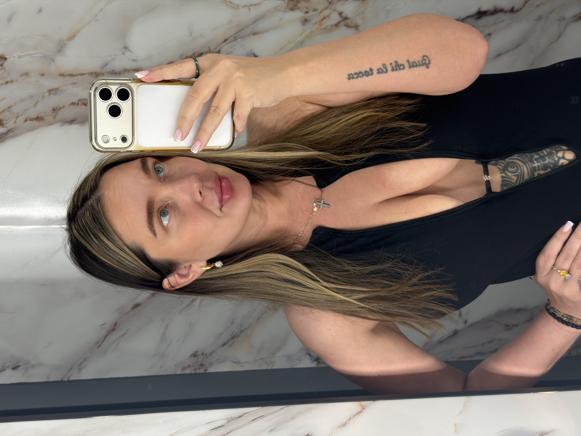 Woman Takes Selfies in Moscow Bathroom Setting