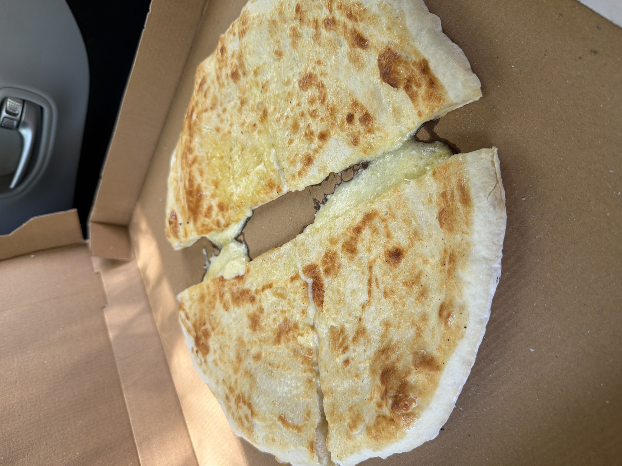 Casual moments captured in Mtskheta: takeout food, resting cat
