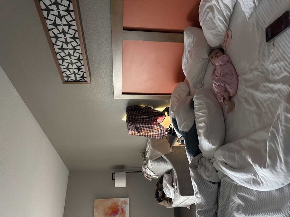 Infant in pink pajamas observed in disheveled Dallas hotel room