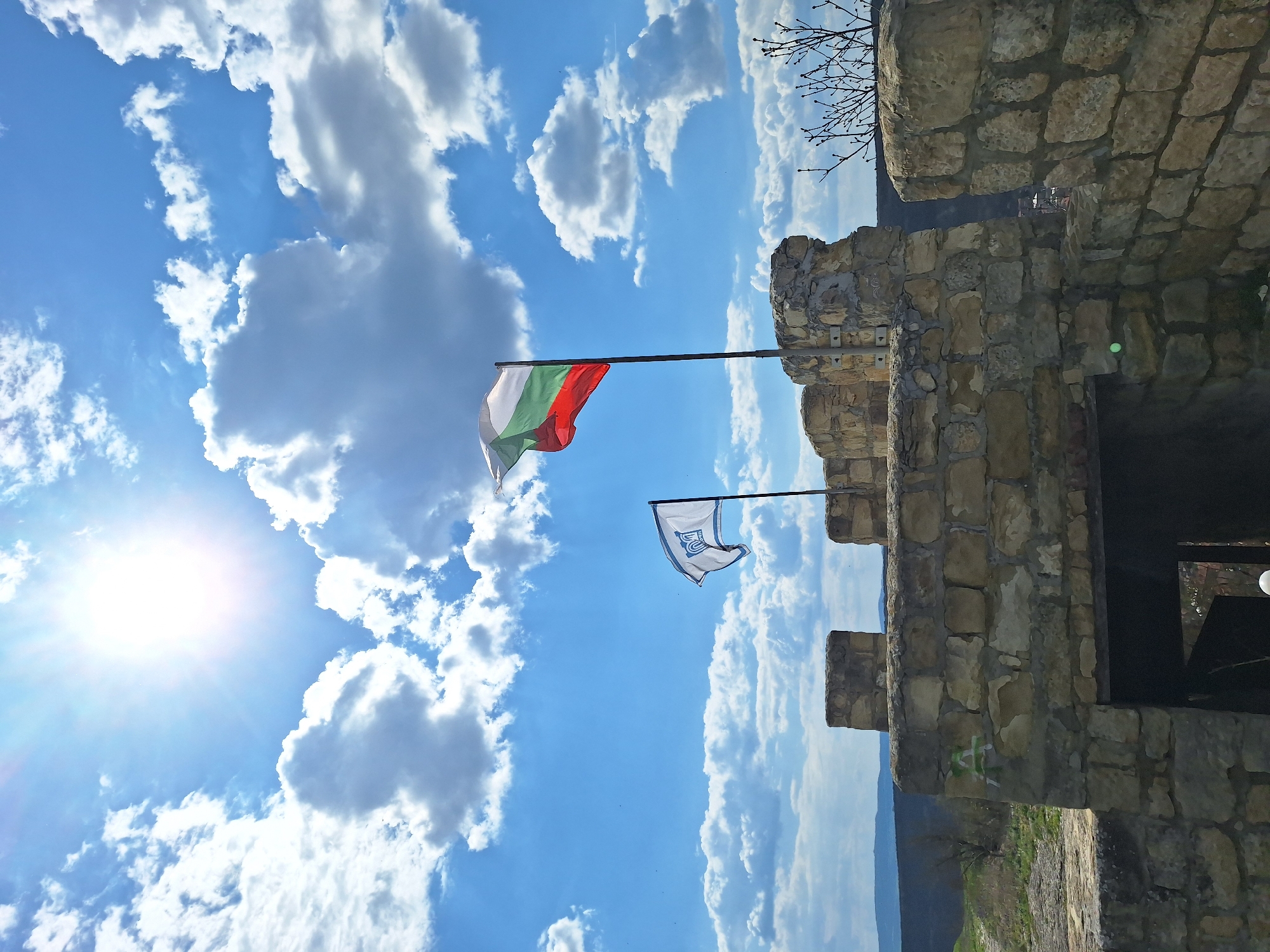 Tourist visits medieval Ovech Fortress in Bulgaria under sunny skies