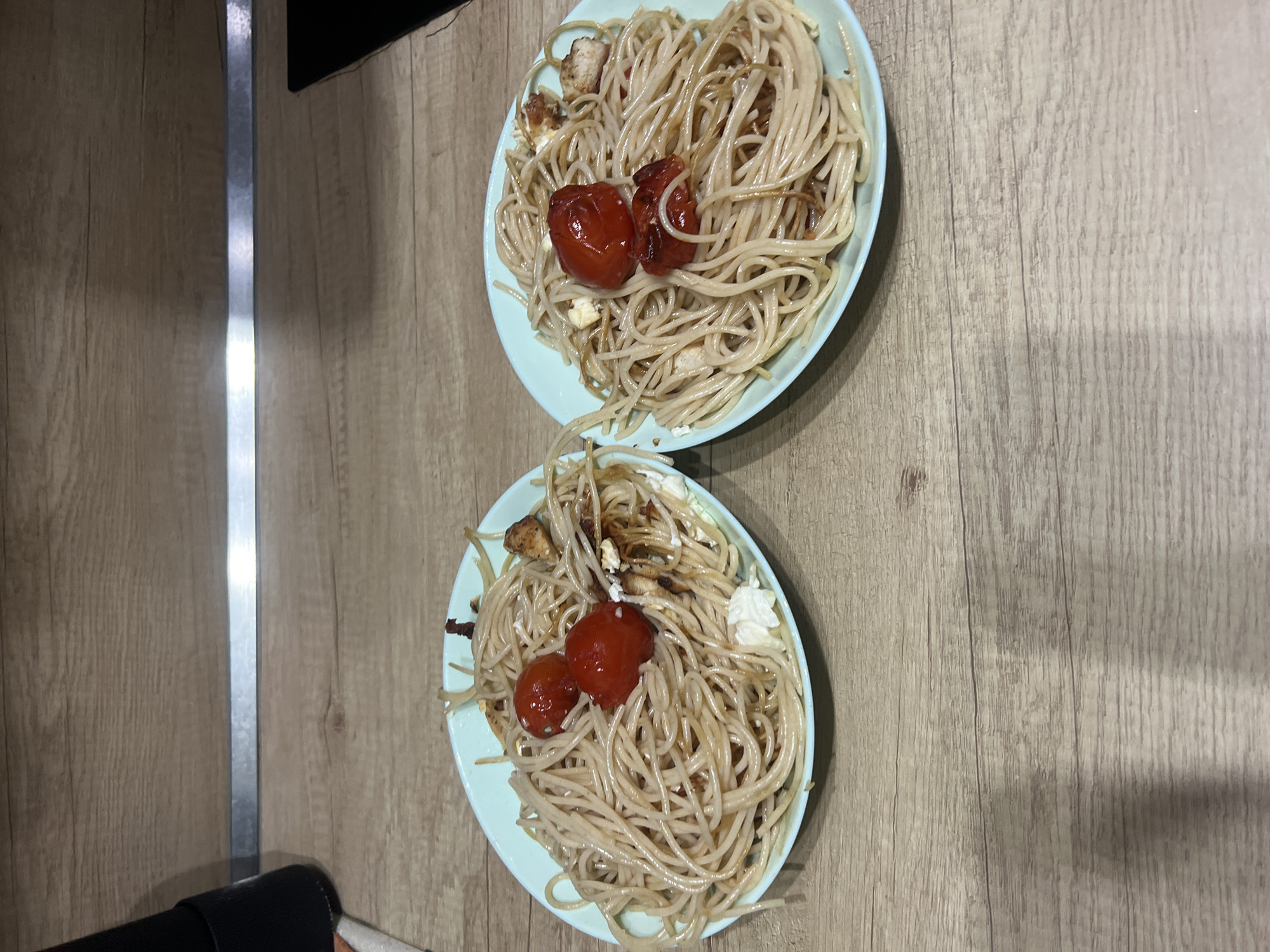 Spaghetti dinner photographed on wooden table in Plovdiv