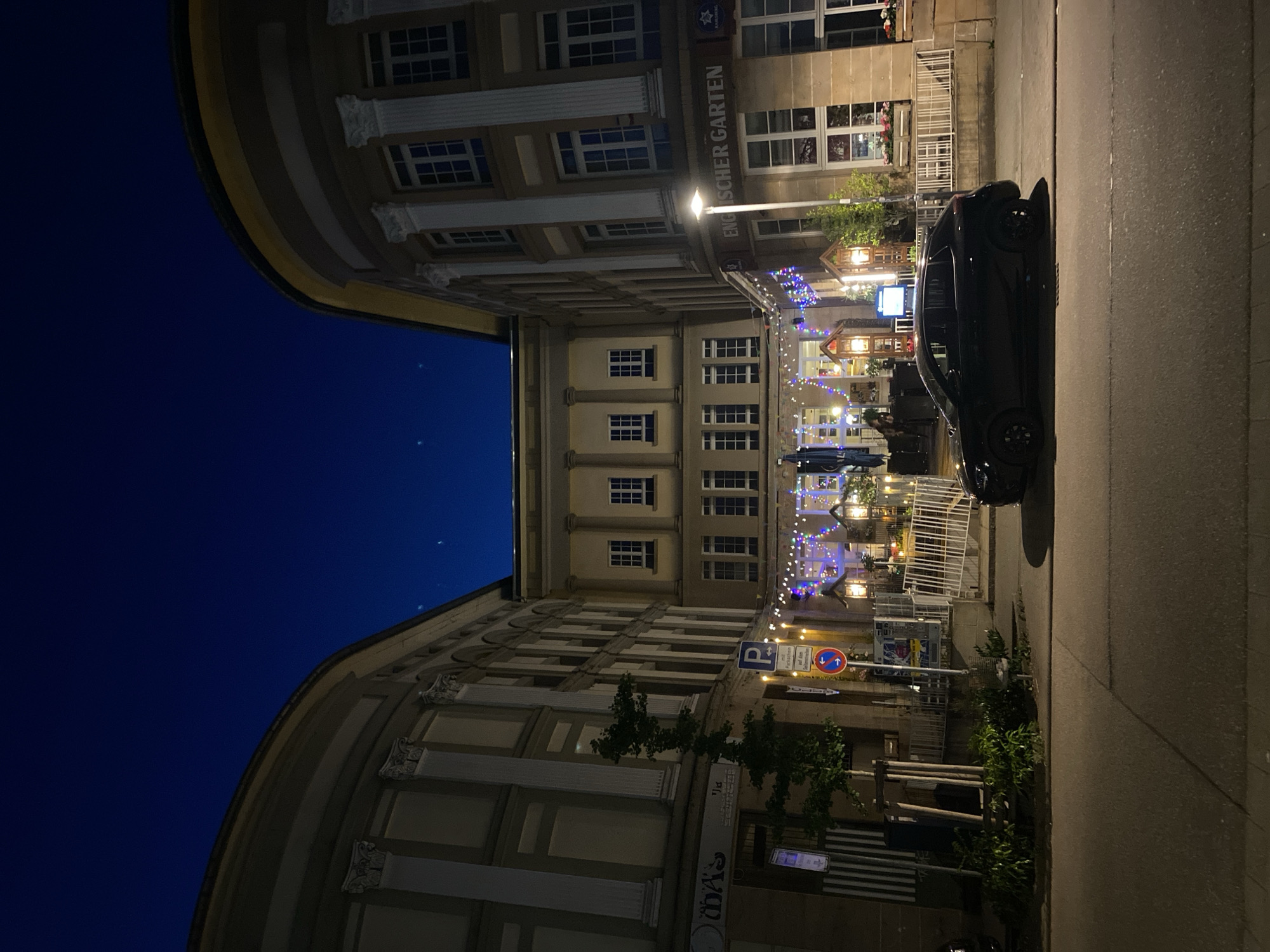 Evening photography captures Landau's restaurant district and illuminated church