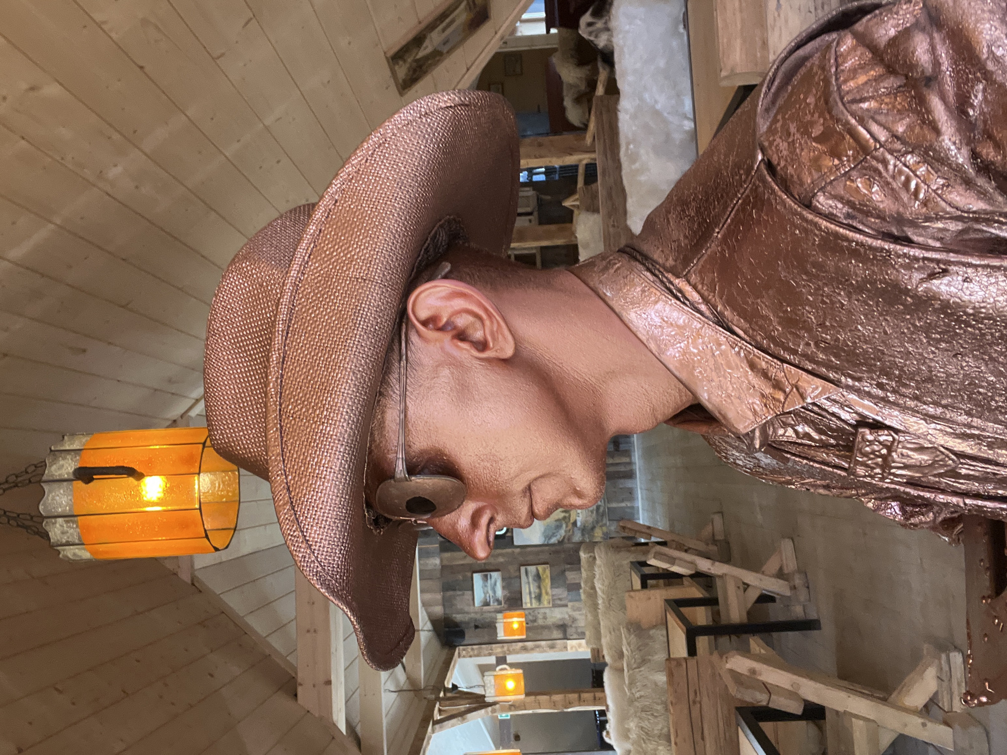 Bronze-painted street performer in cowboy hat, Zakopane