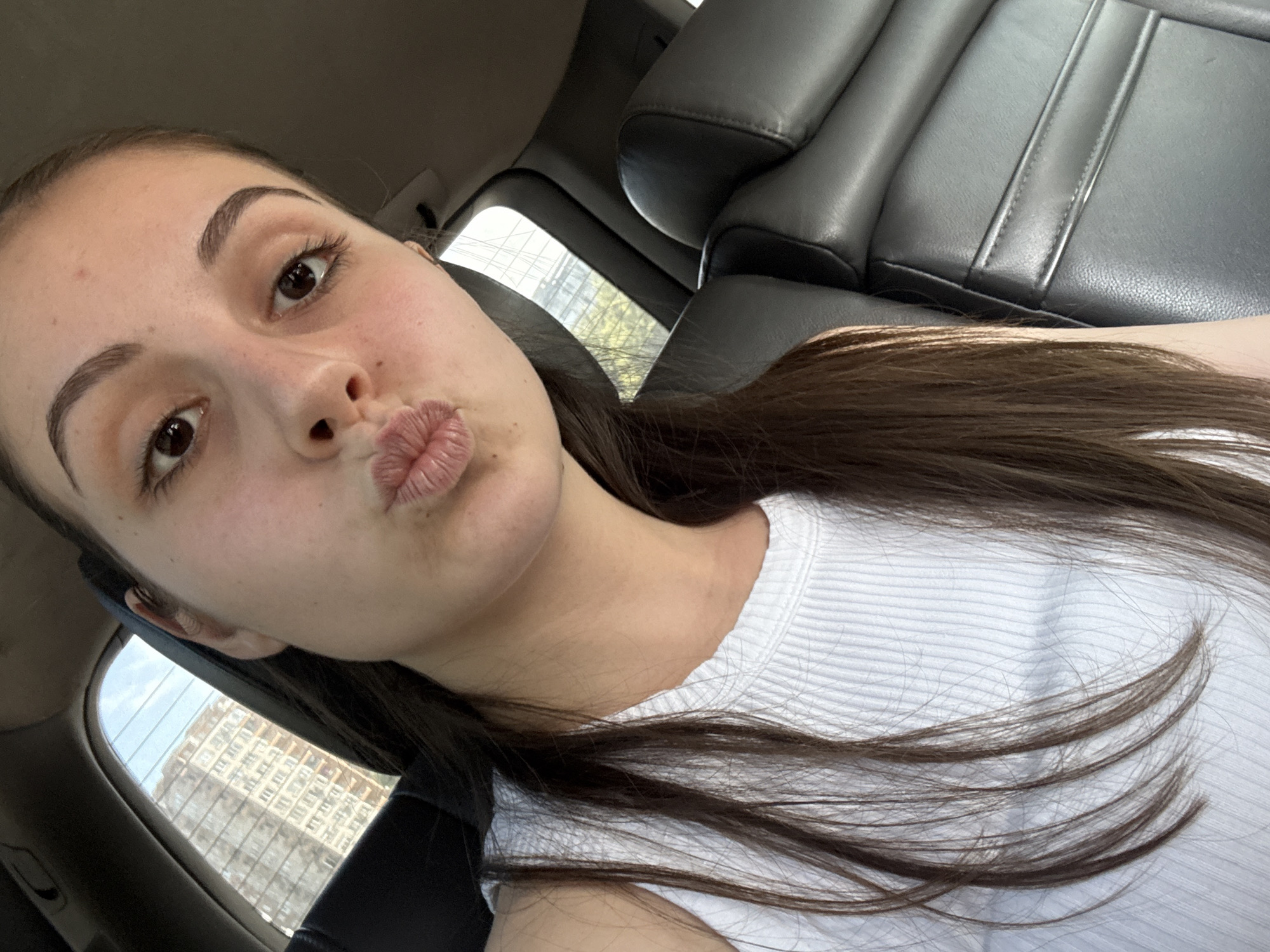 Woman takes playful car selfies in Burgas, Bulgaria