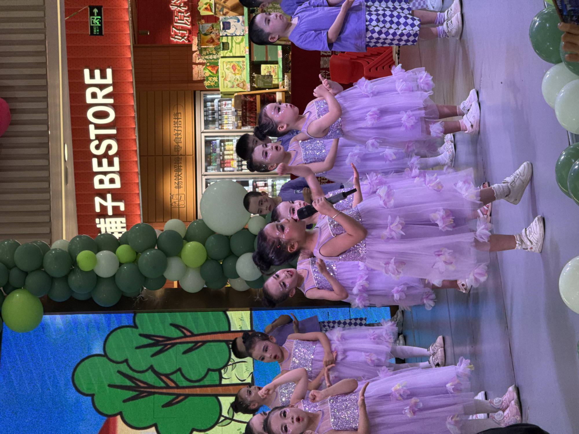 Children perform dance routine at Jiulongpo shopping mall
