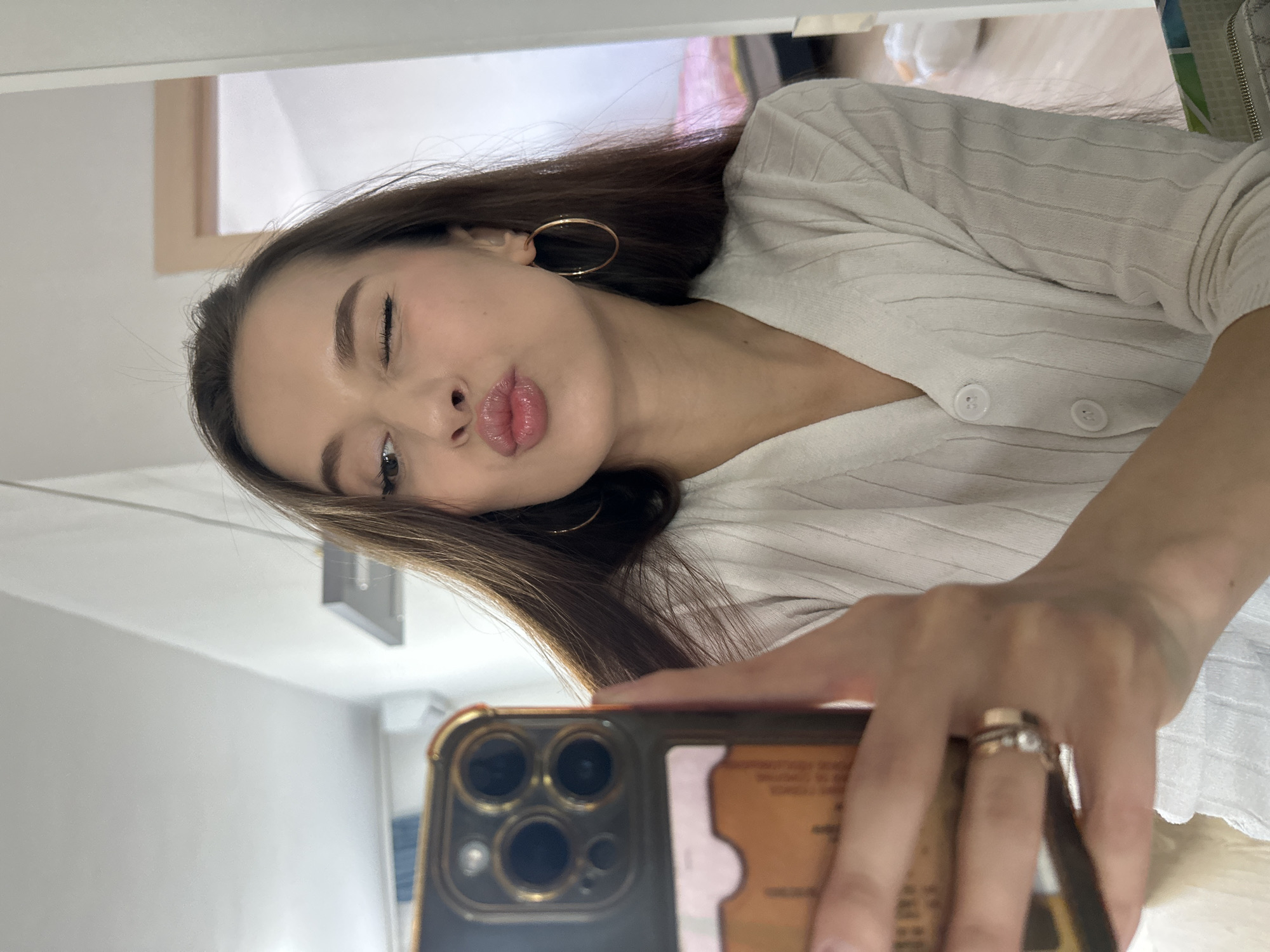 Woman takes playful mirror selfies in Yekaterinburg apartment