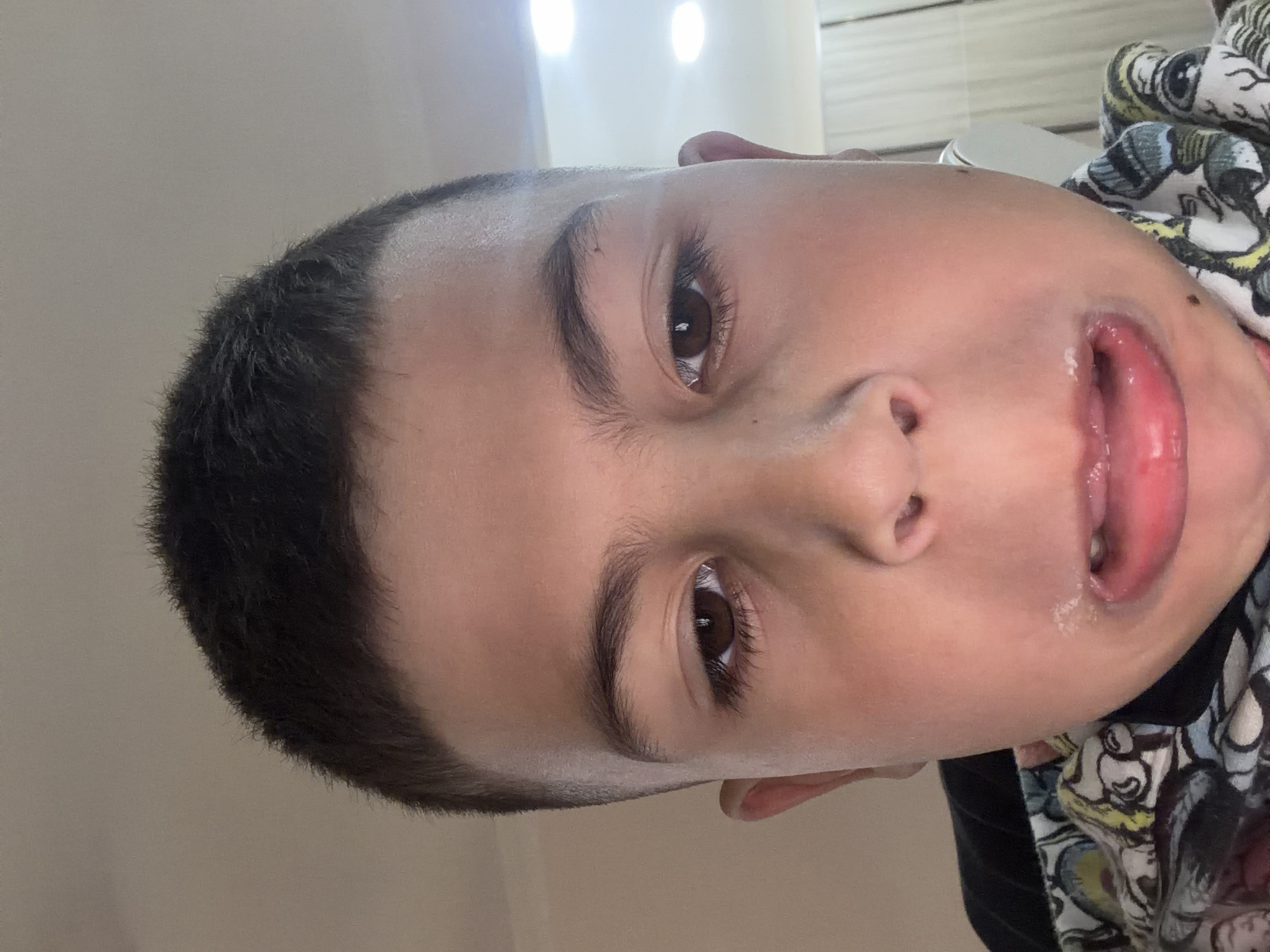 Child films playful self-portrait on phone in Yerevan