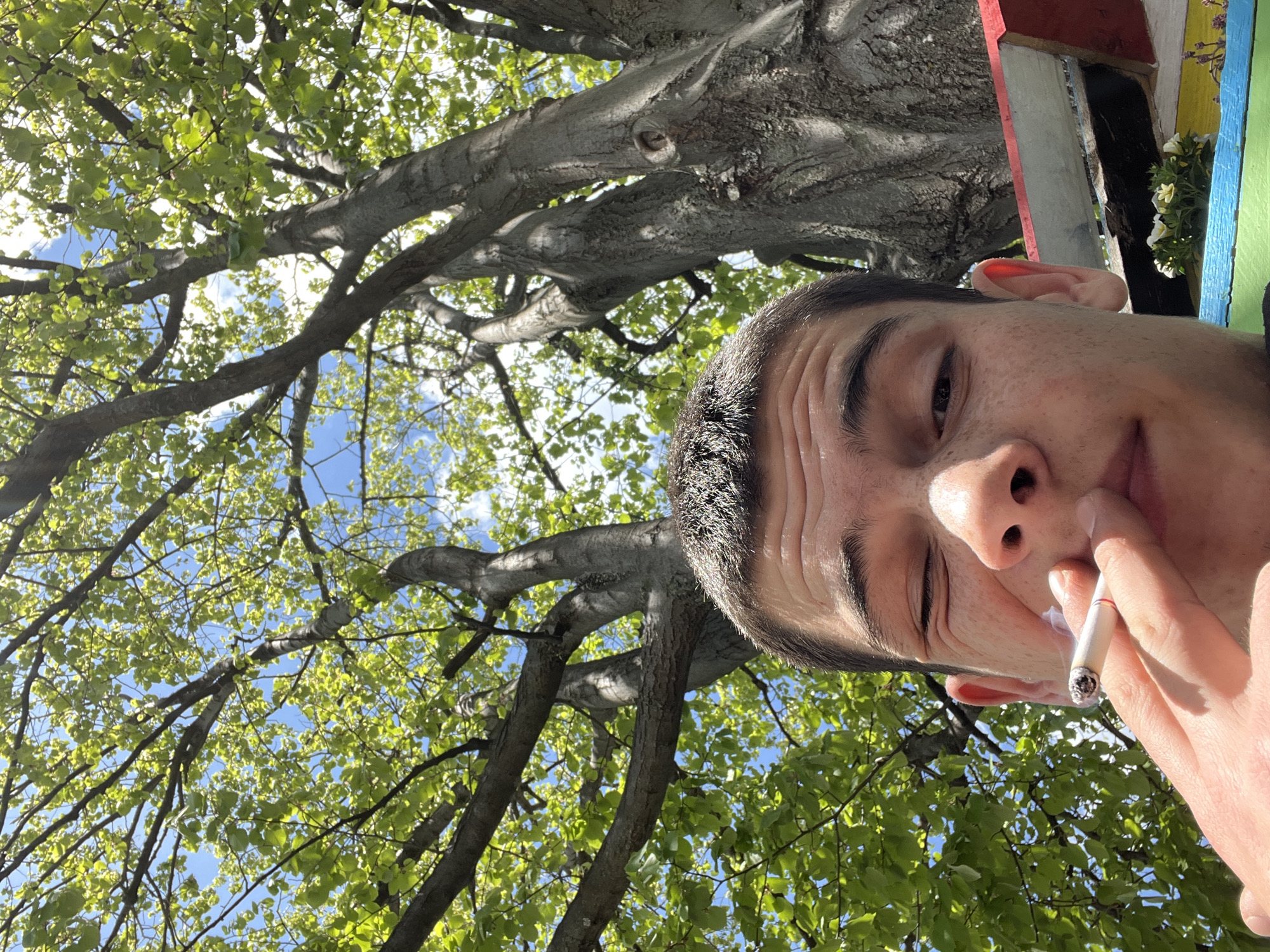 Young man smoking documented around Sopot, Bulgaria morning hours