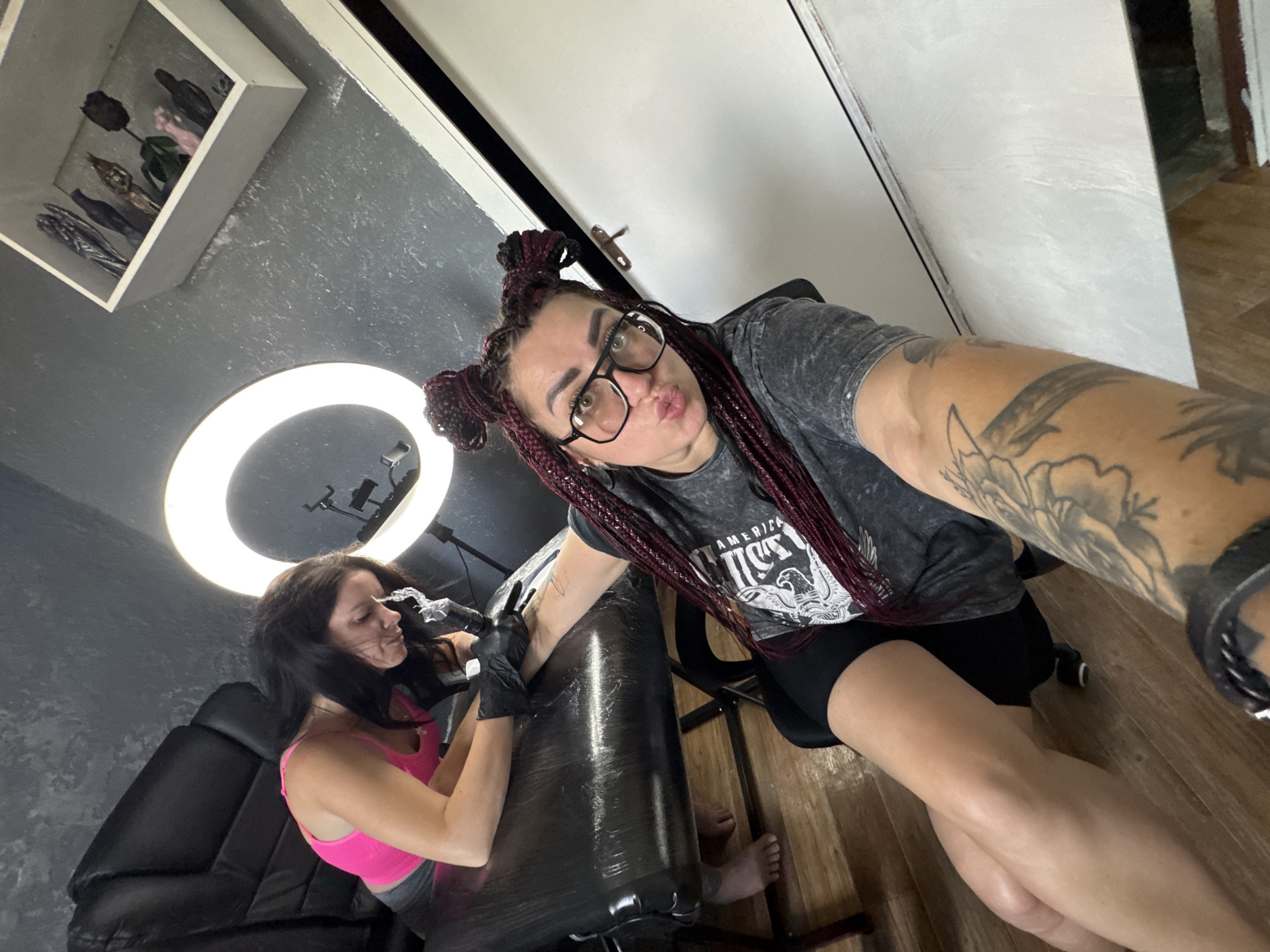 Tattoo session in a Tolyatti studio with selfies in between