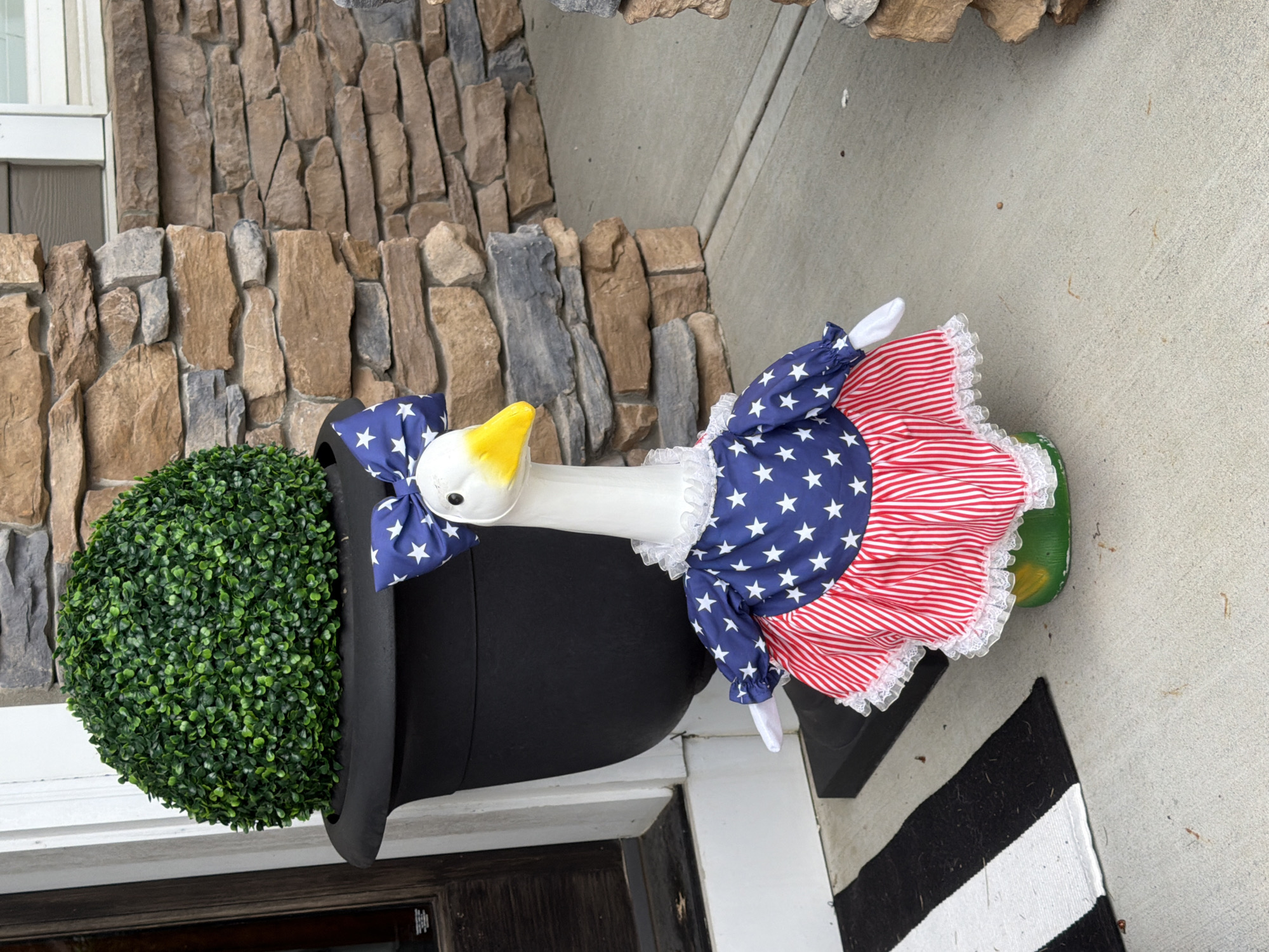 Patriotic goose lawn ornament on a Wexford porch