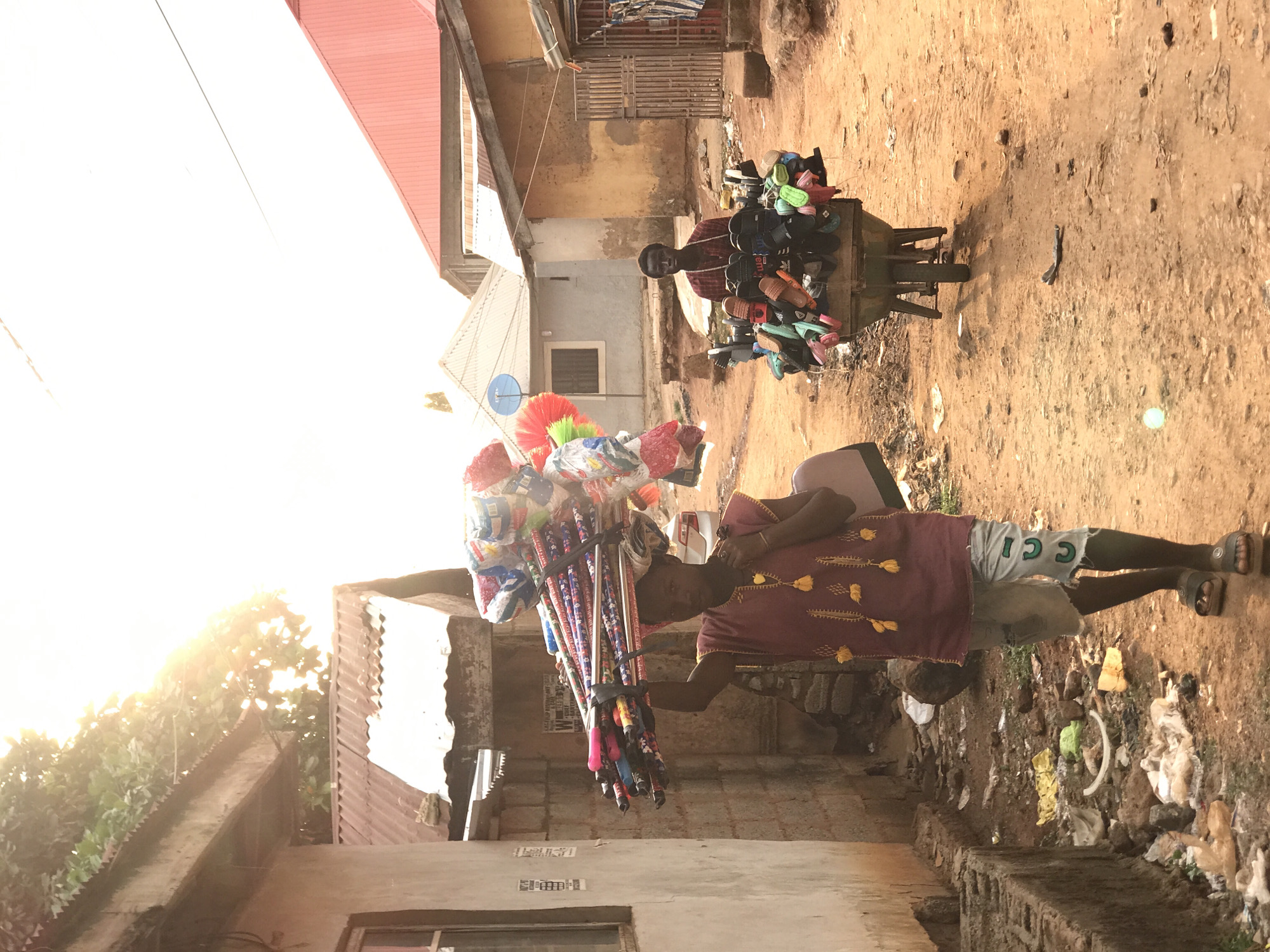 Daily street commerce and residential life documented in Dutsen Alhaji