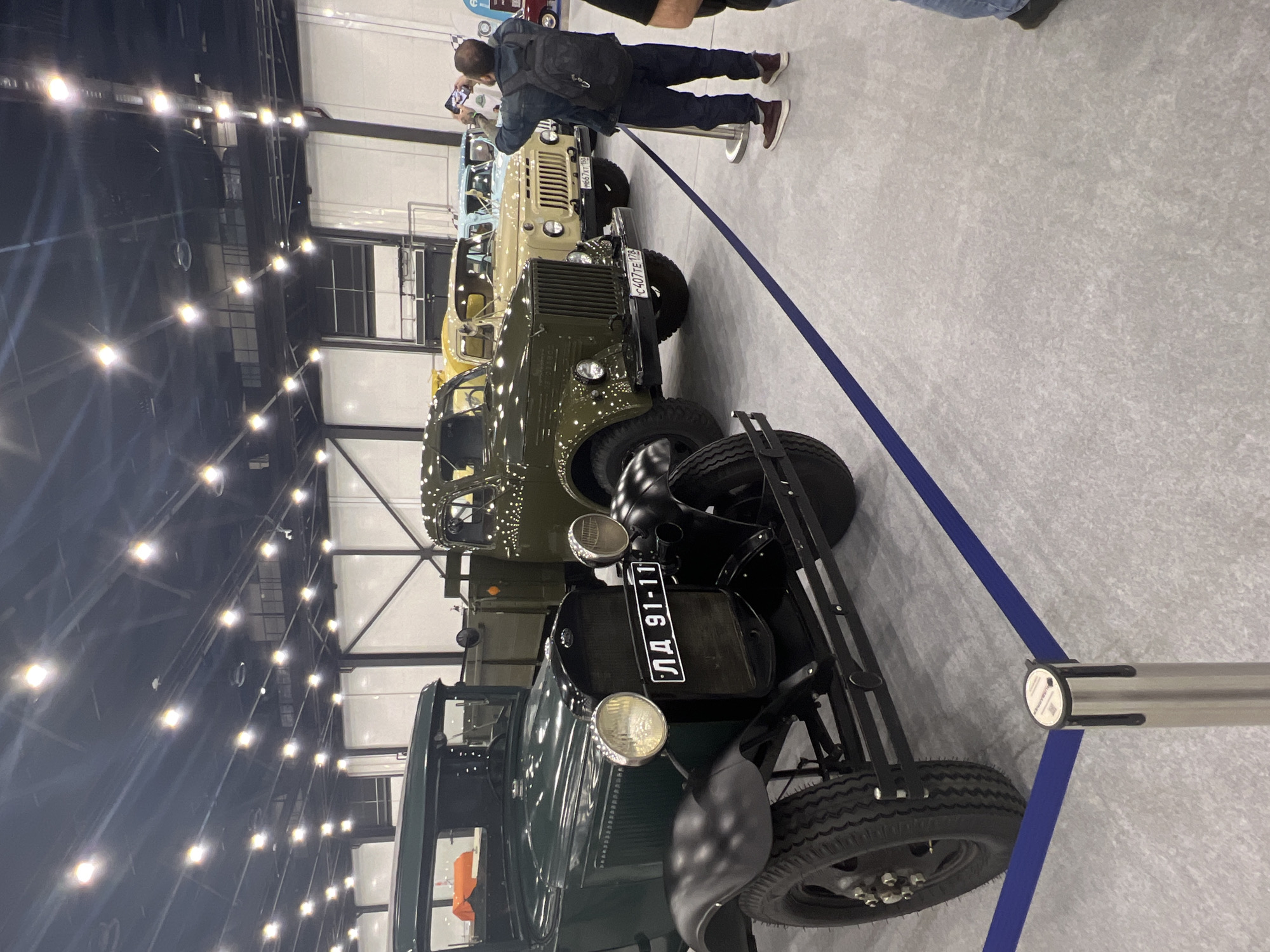 Classic car exhibition showcases vintage automobiles indoors