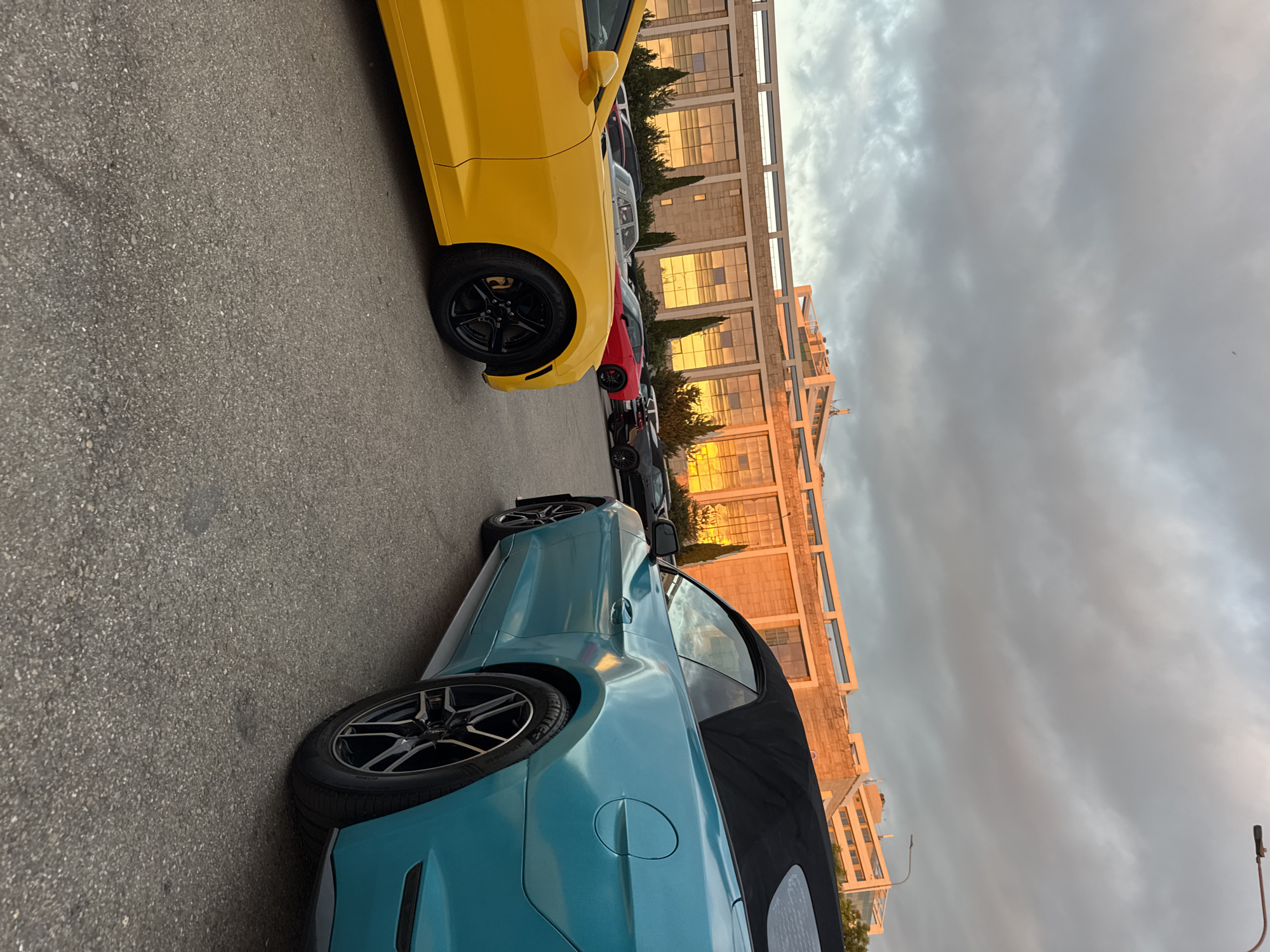 Sunset evening at Sirius waterfront: harbor, planes, and sports cars