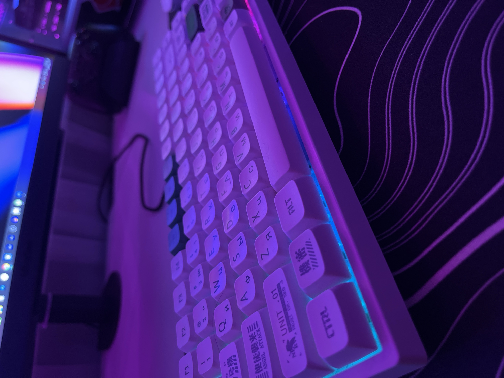 Custom mechanical keyboard with RGB lighting and mixed-script keycaps