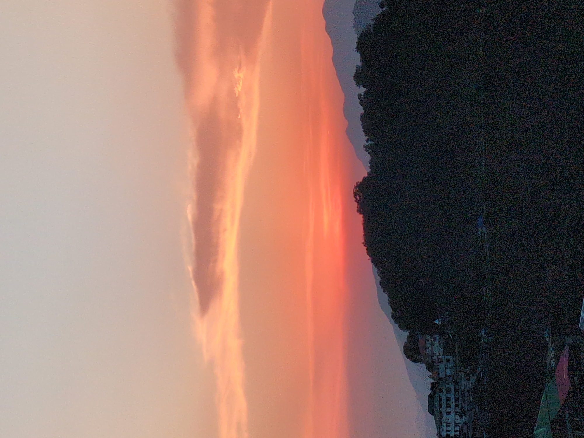 Sunset views across Naddi's rolling hills and residential clusters