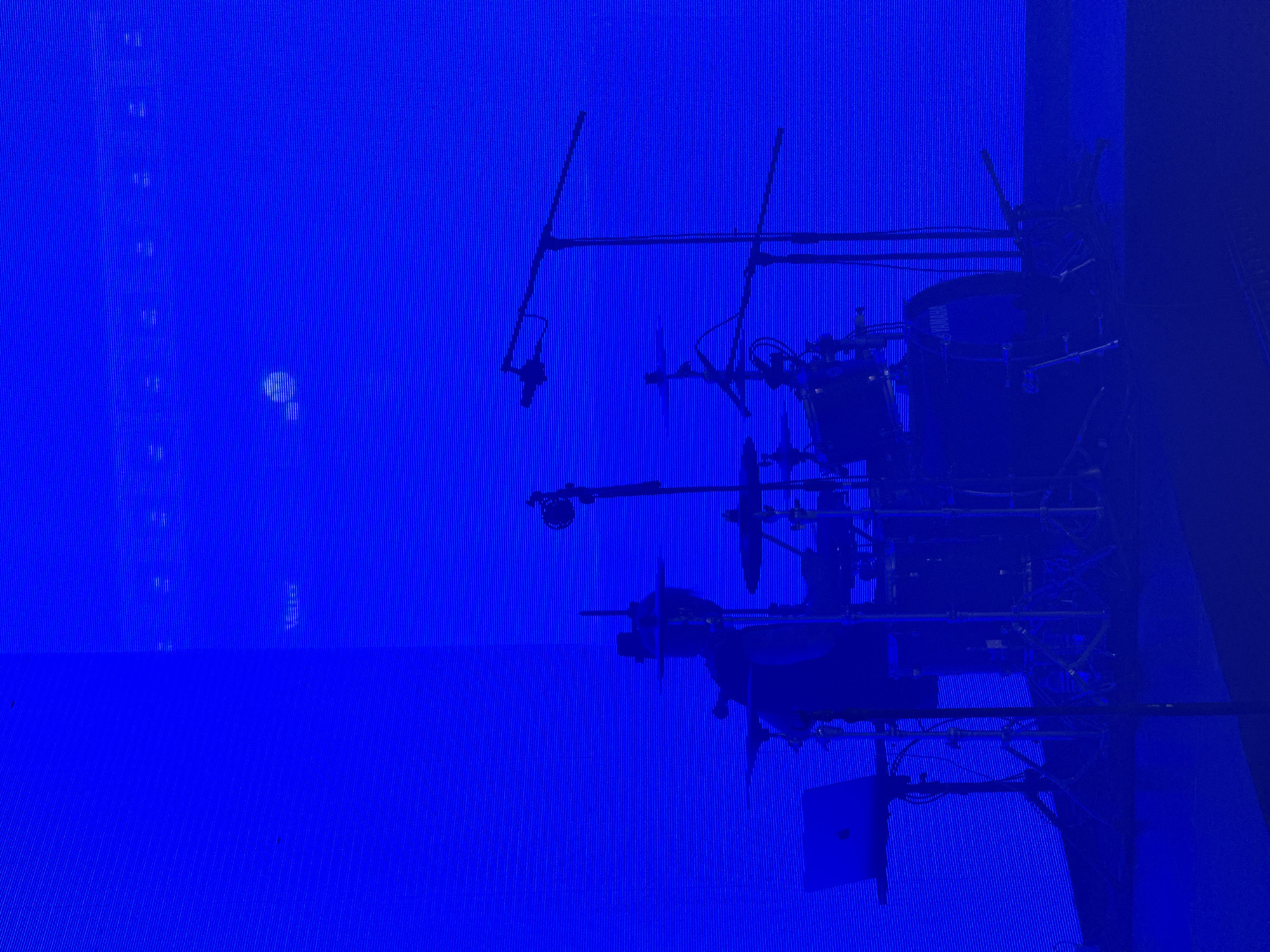 Drum set spotted under blue lights in Saint Petersburg