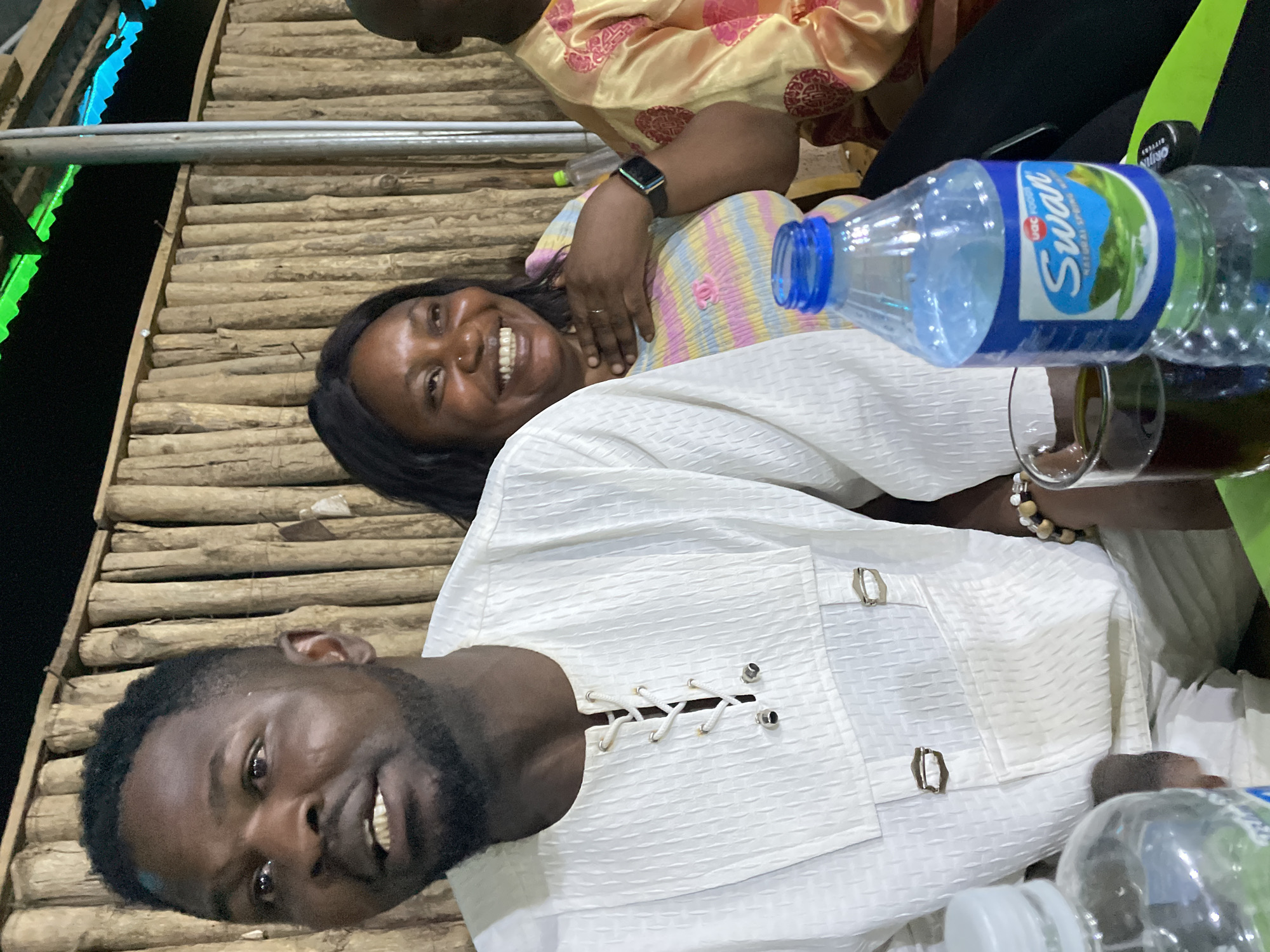 Evening social gathering with pool game captured in Jos