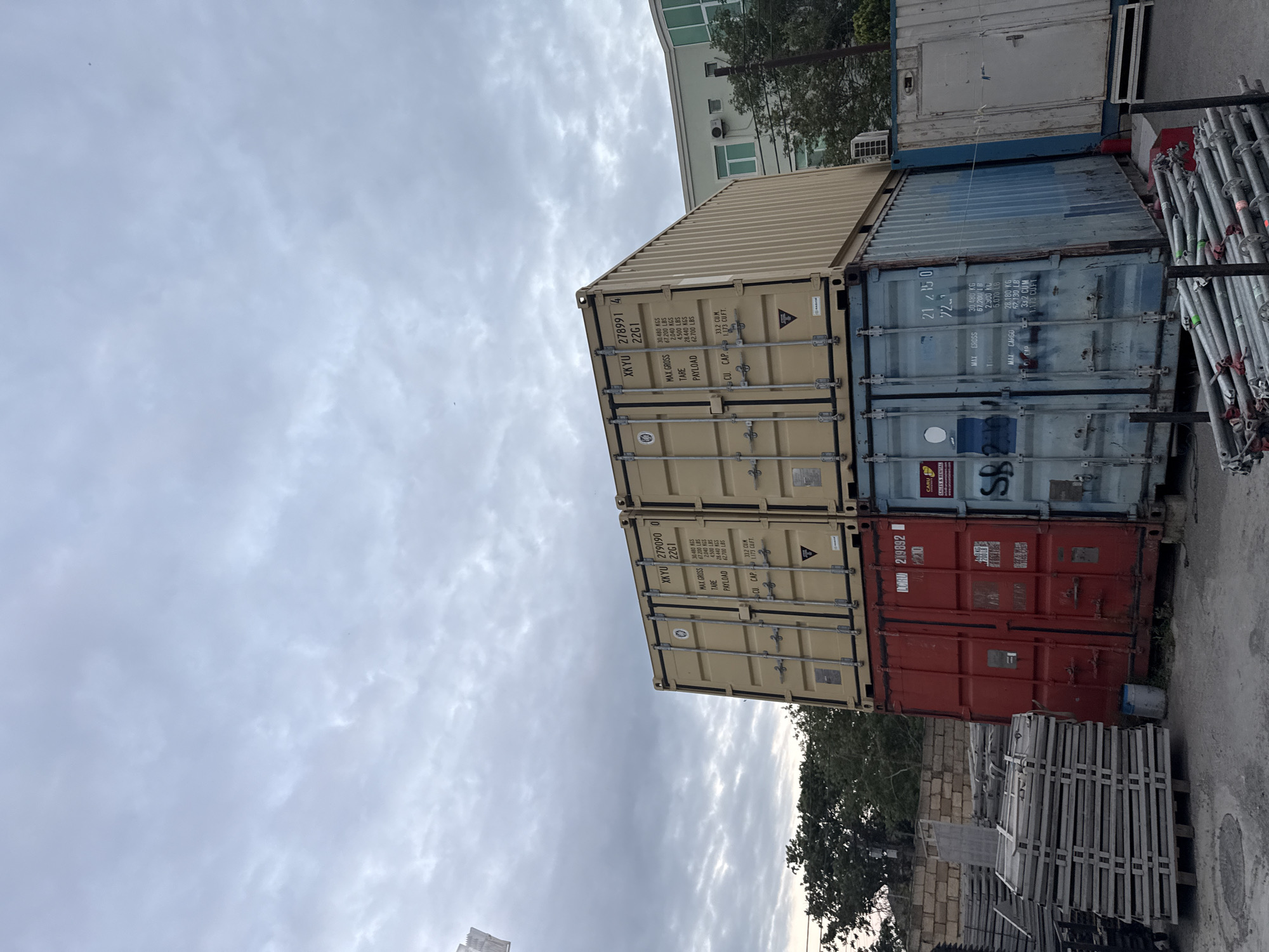 Event production yard in Baku, complete with gear, containers, and dogs