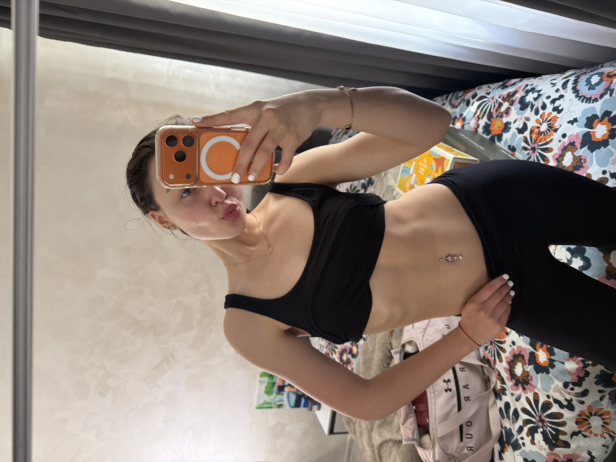 Woman takes morning mirror selfies in Pernik bedroom