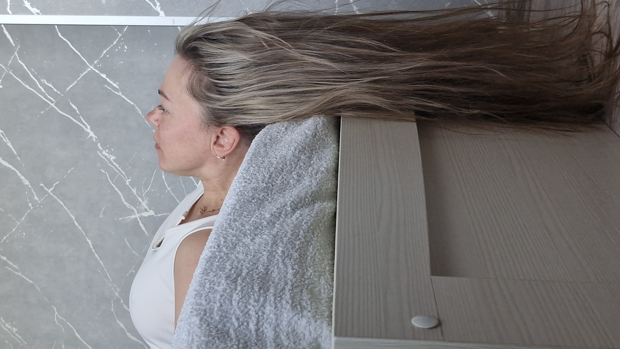 Woman resting on towel observed in Otchor, Russia