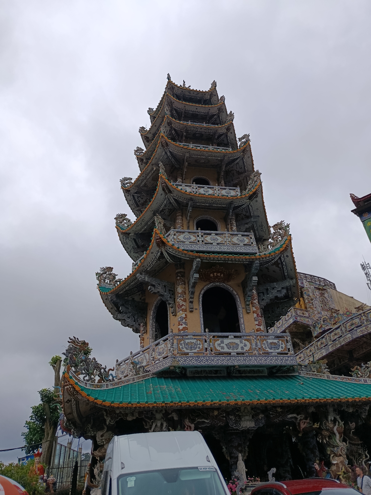 Long Sơn Pagoda's ornate facades and misty mountain backdrop, Xuân Thành