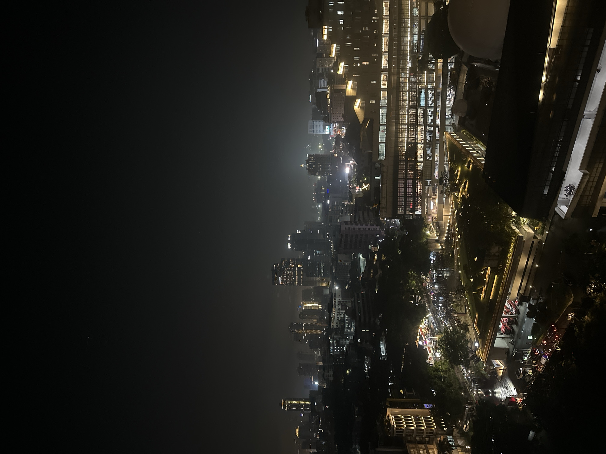 Nighttime aerial views capture illuminated Central Jakarta cityscape