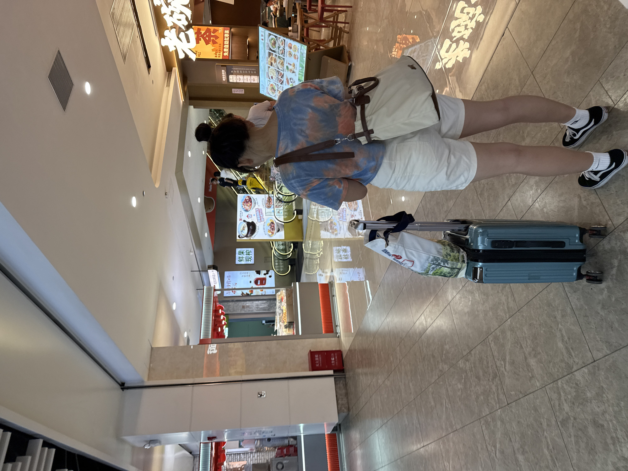 Inside a Haizhu District mall, food spots and foot traffic