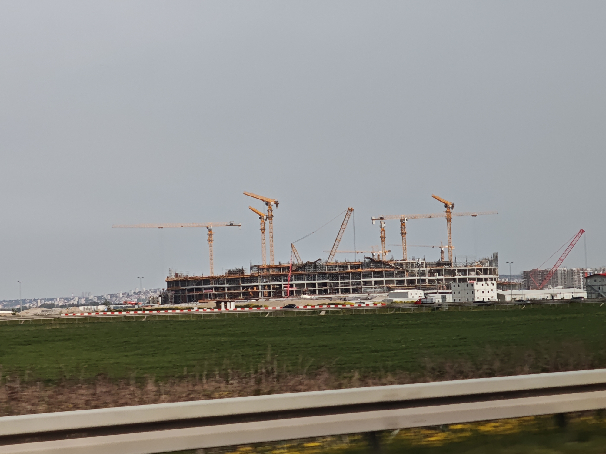 Construction project with yellow cranes documented in Surcin, Serbia