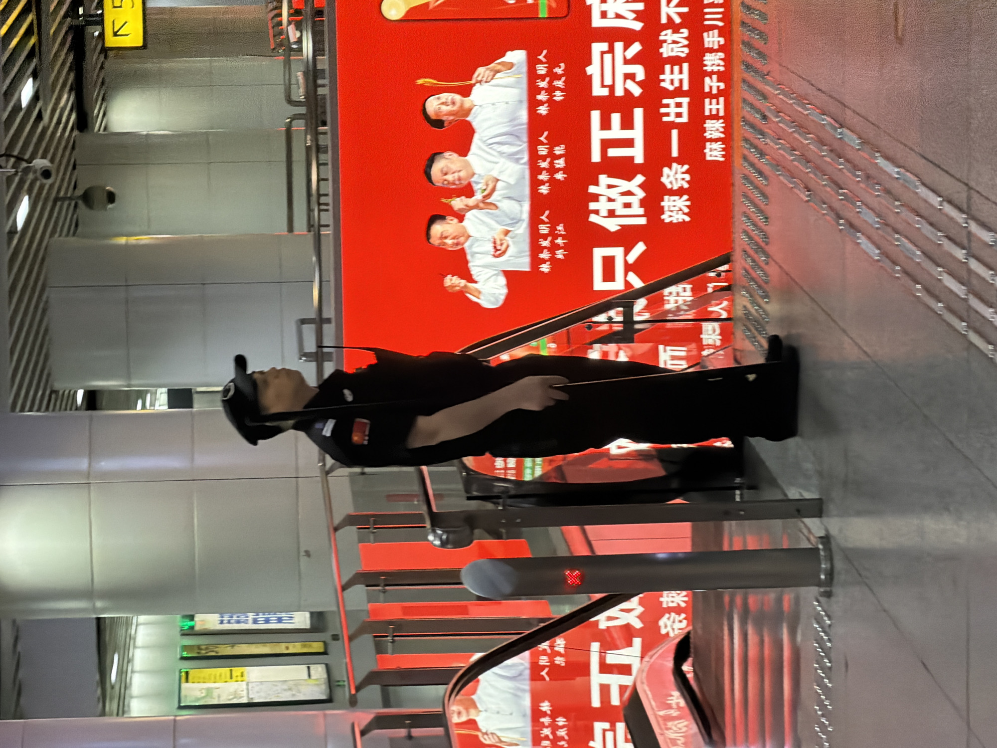 Street scene outside a bold red food advertisement in Yuzhong District