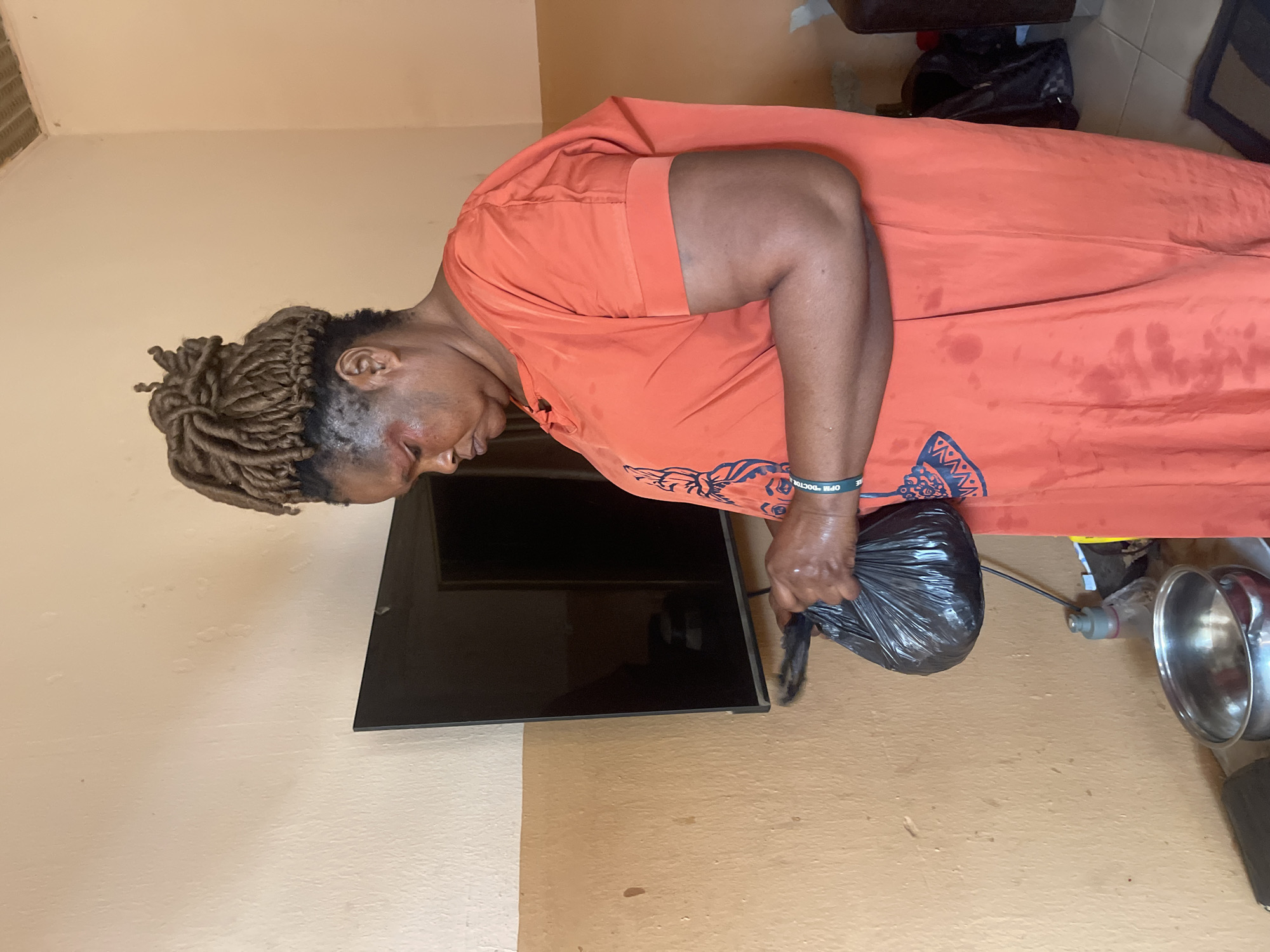 Woman in orange dress spotted with bag in Muchiya
