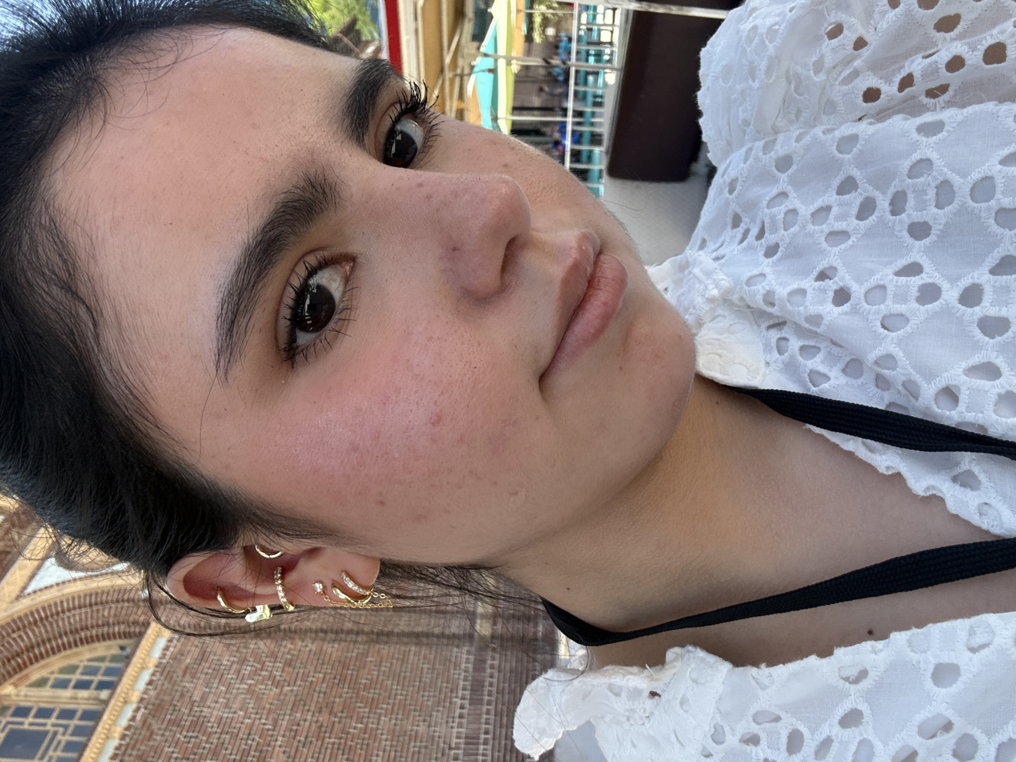 Close-up selfie in LA, gold earrings and eyelet lace