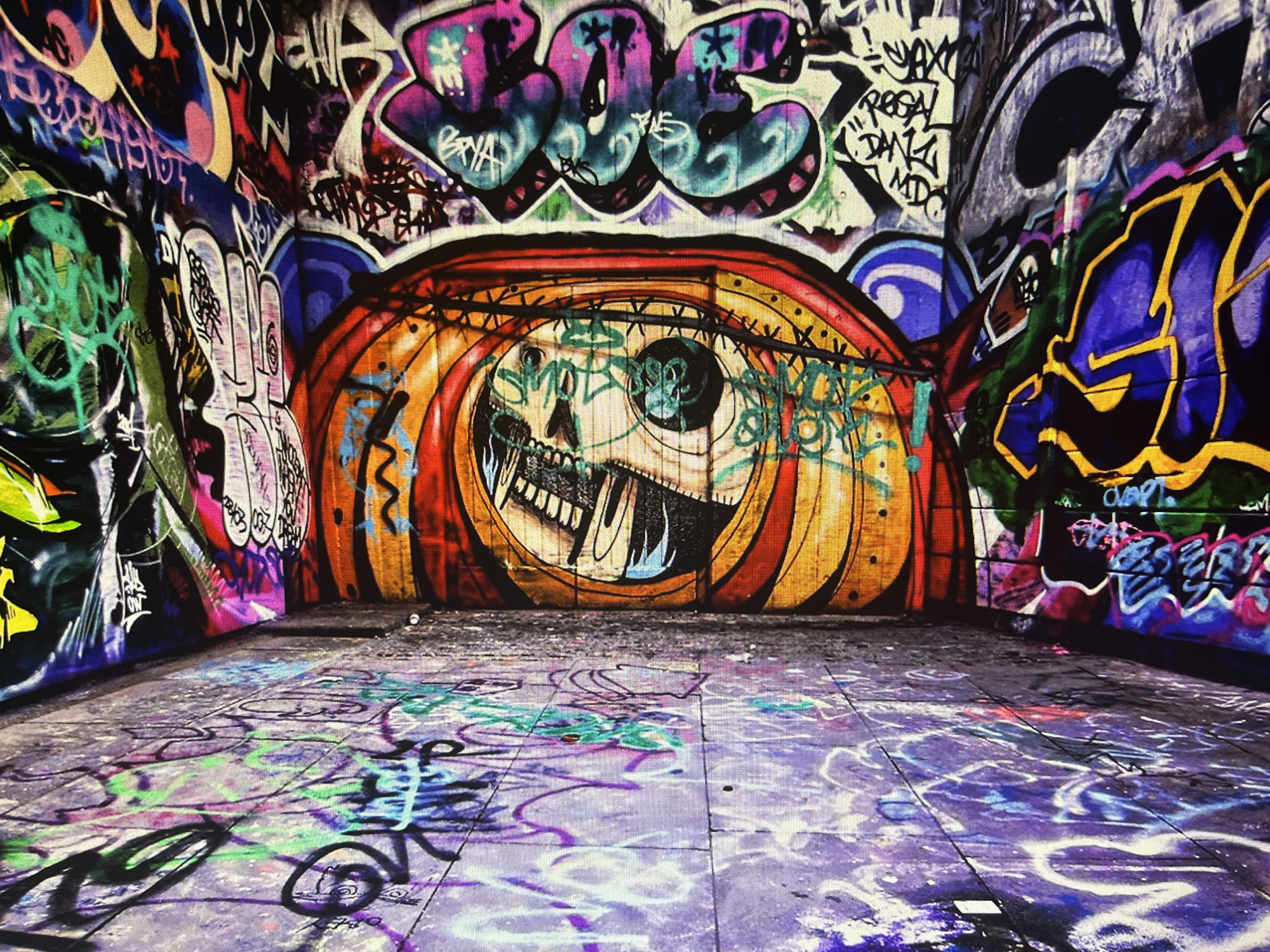 Graffiti-saturated tunnels and alleys, urban streets at night
