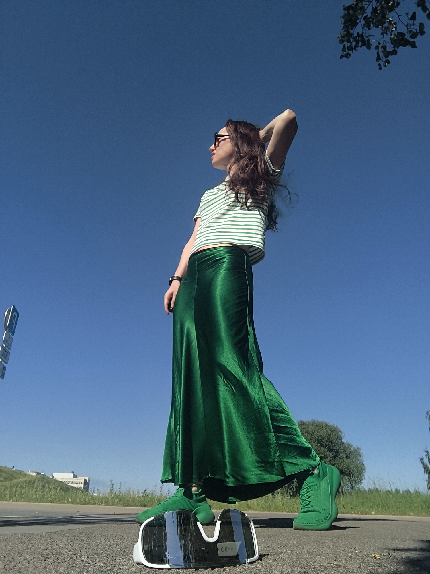All-green outfit shoot on a sunny afternoon in Riga