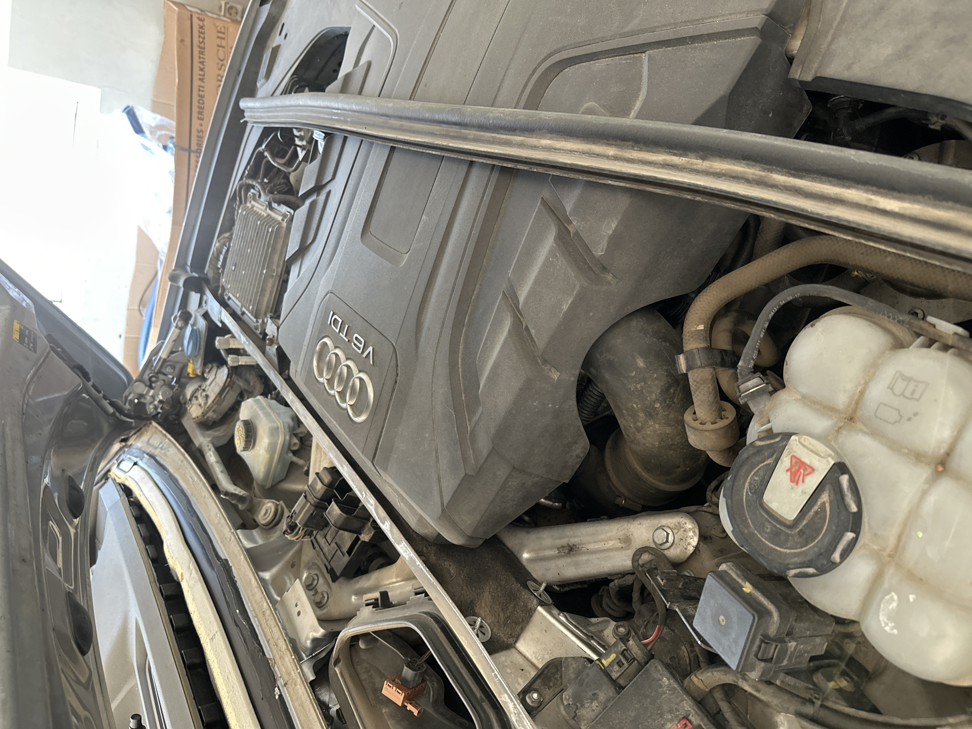Automotive repair shop services multiple Audi vehicles, motorcycle