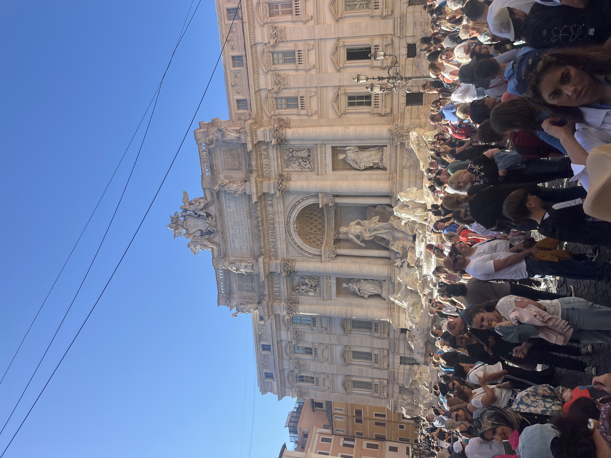 Daytime crowds gather at Rome's historic Trevi Fountain