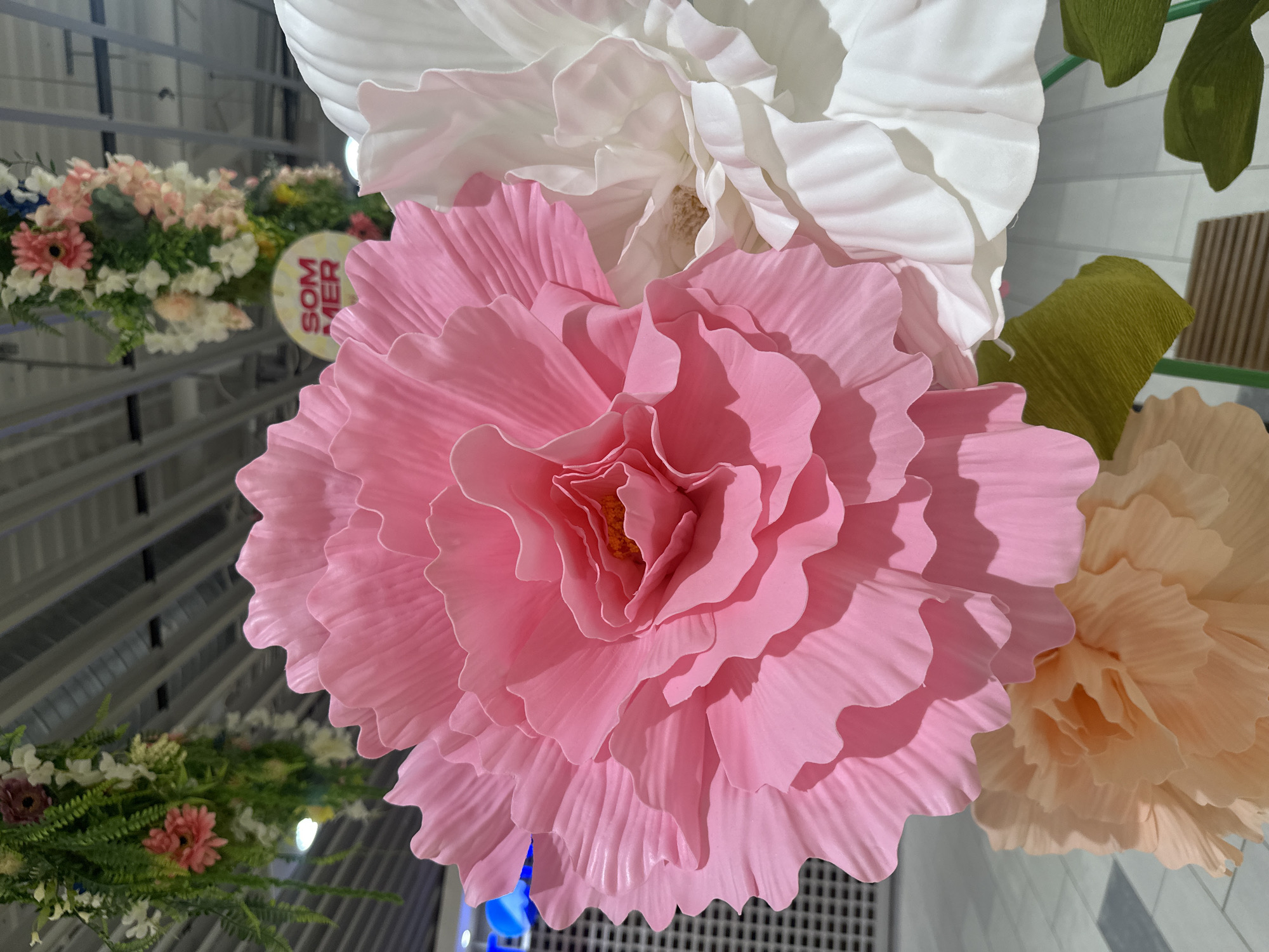 Large-scale artificial flower installation fills indoor space in Slitu