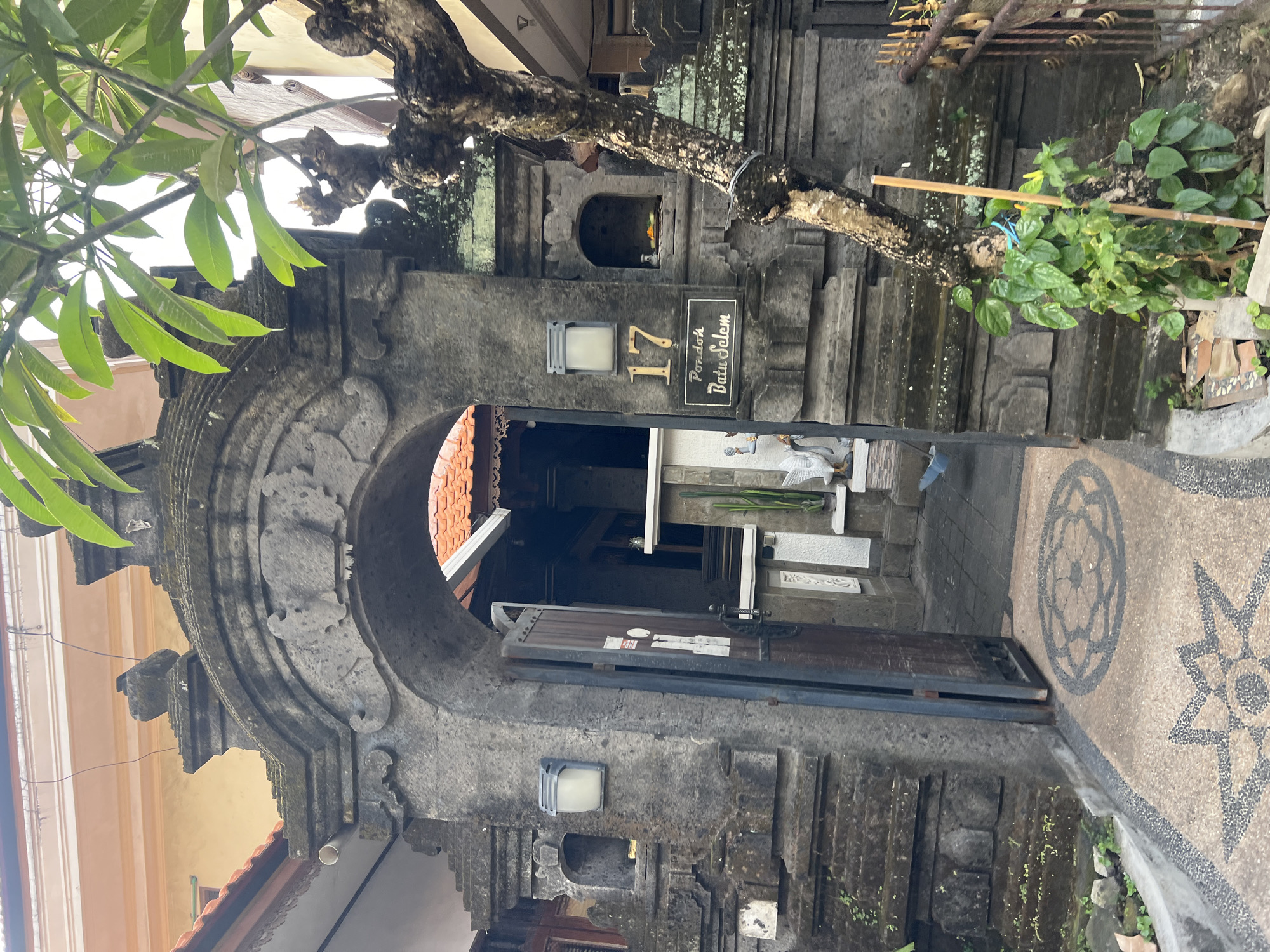 Quiet backstreets and stone gateways in residential Kuta