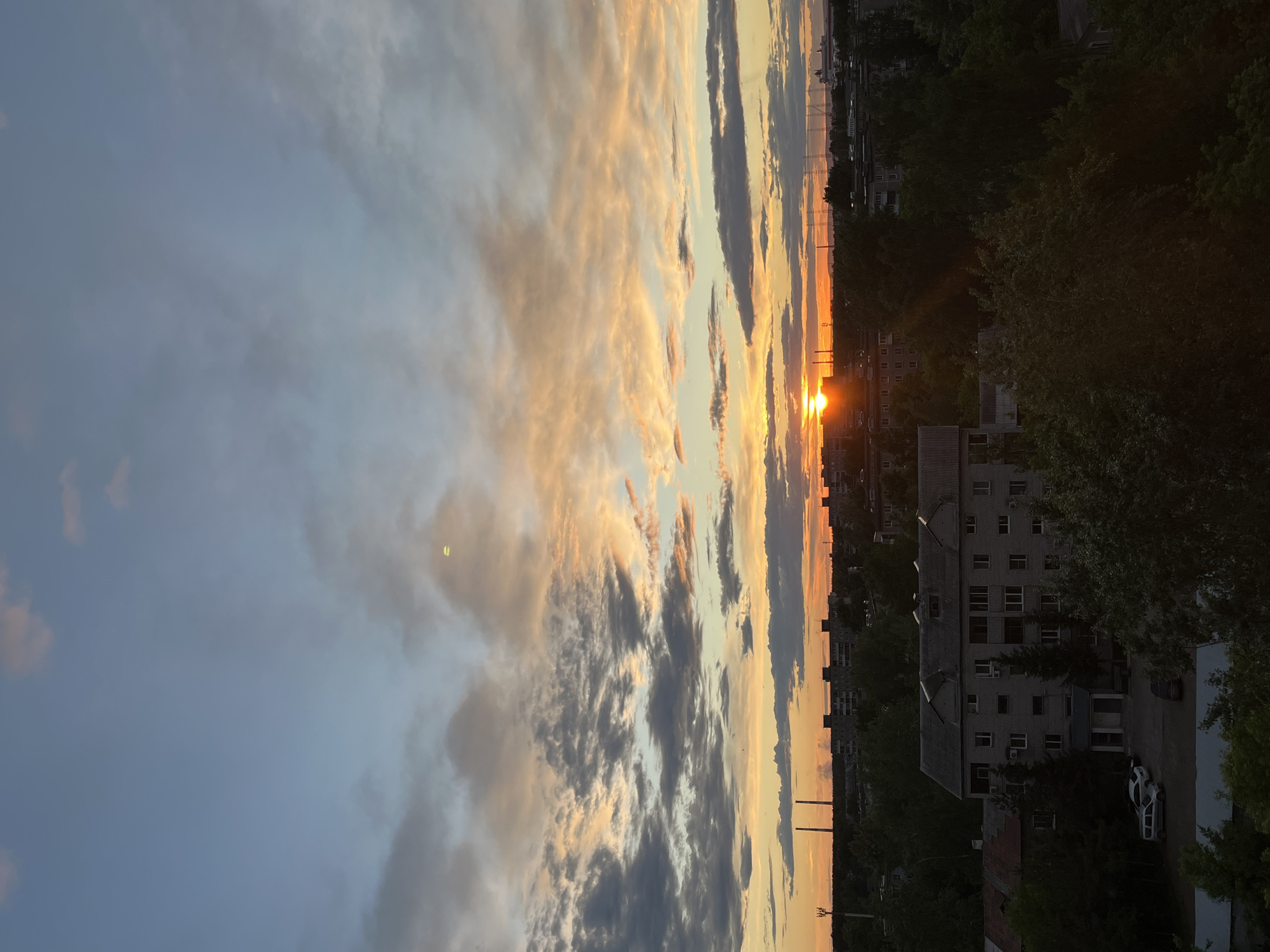 Urban sunset captured by multiple witnesses in unidentified city