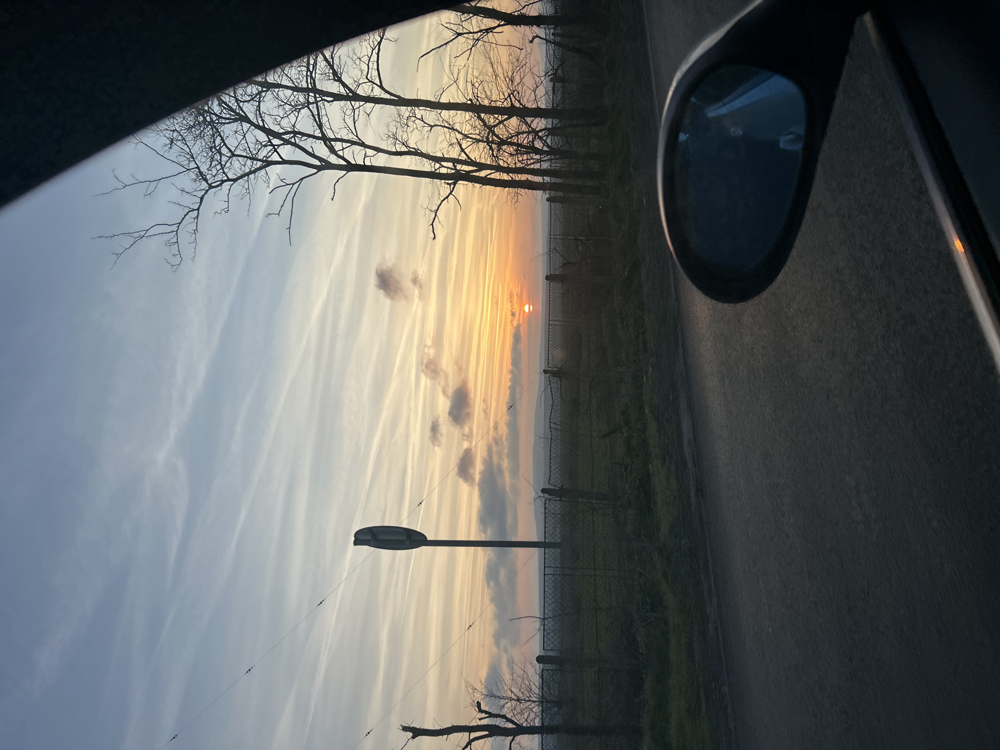 Sunrise or sunset observed from vehicle near Aytos, Bulgaria