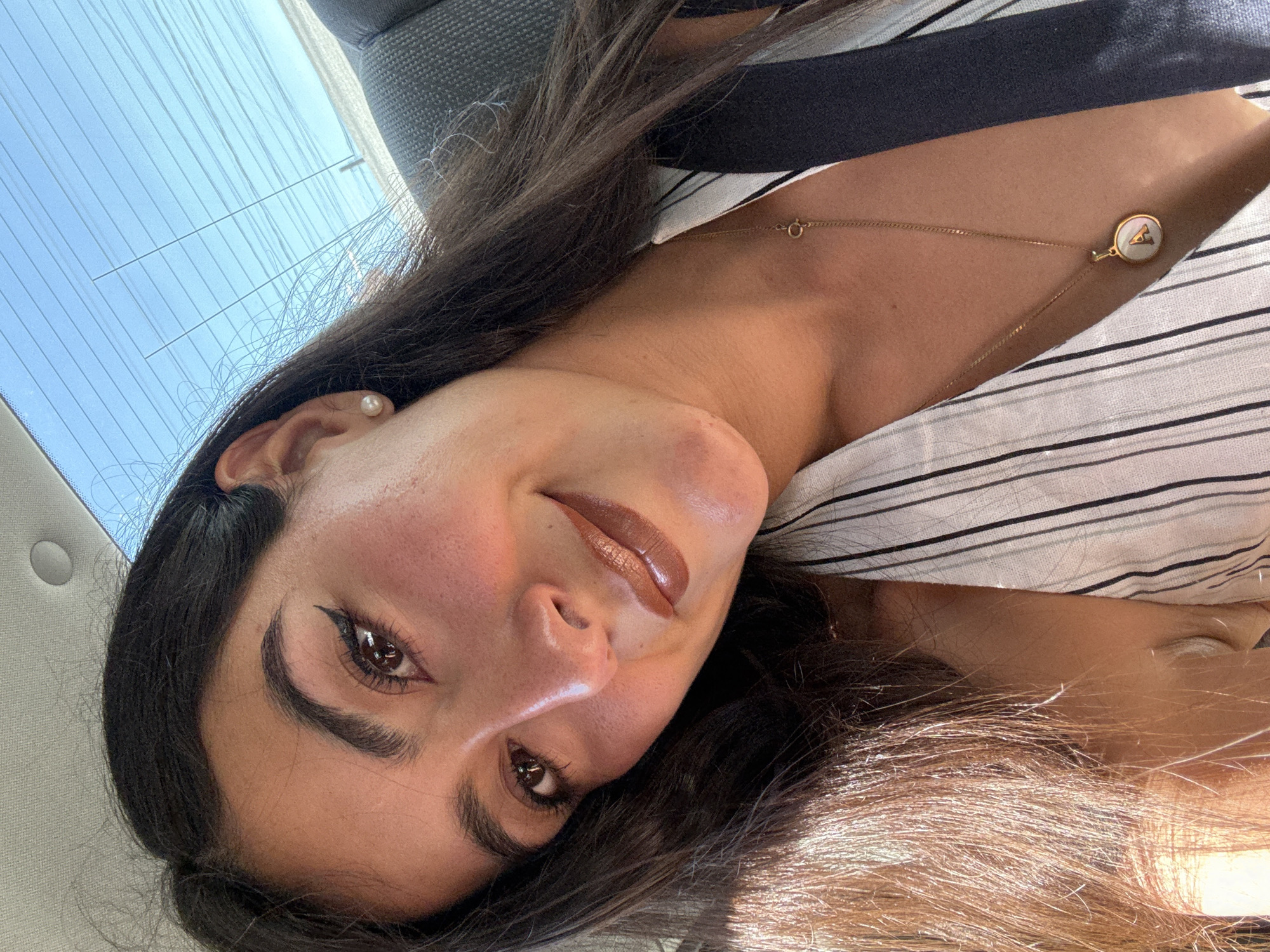 Woman takes selfies in car in Puebla, Mexico