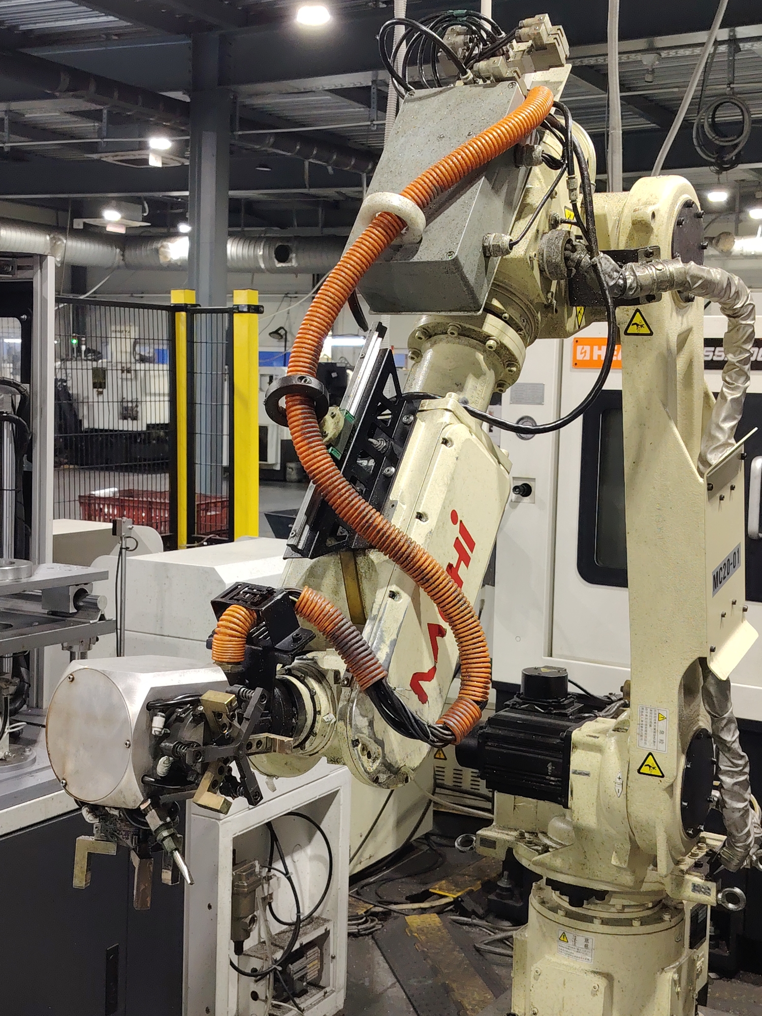 Worn robotic arm documented at Russian industrial facility