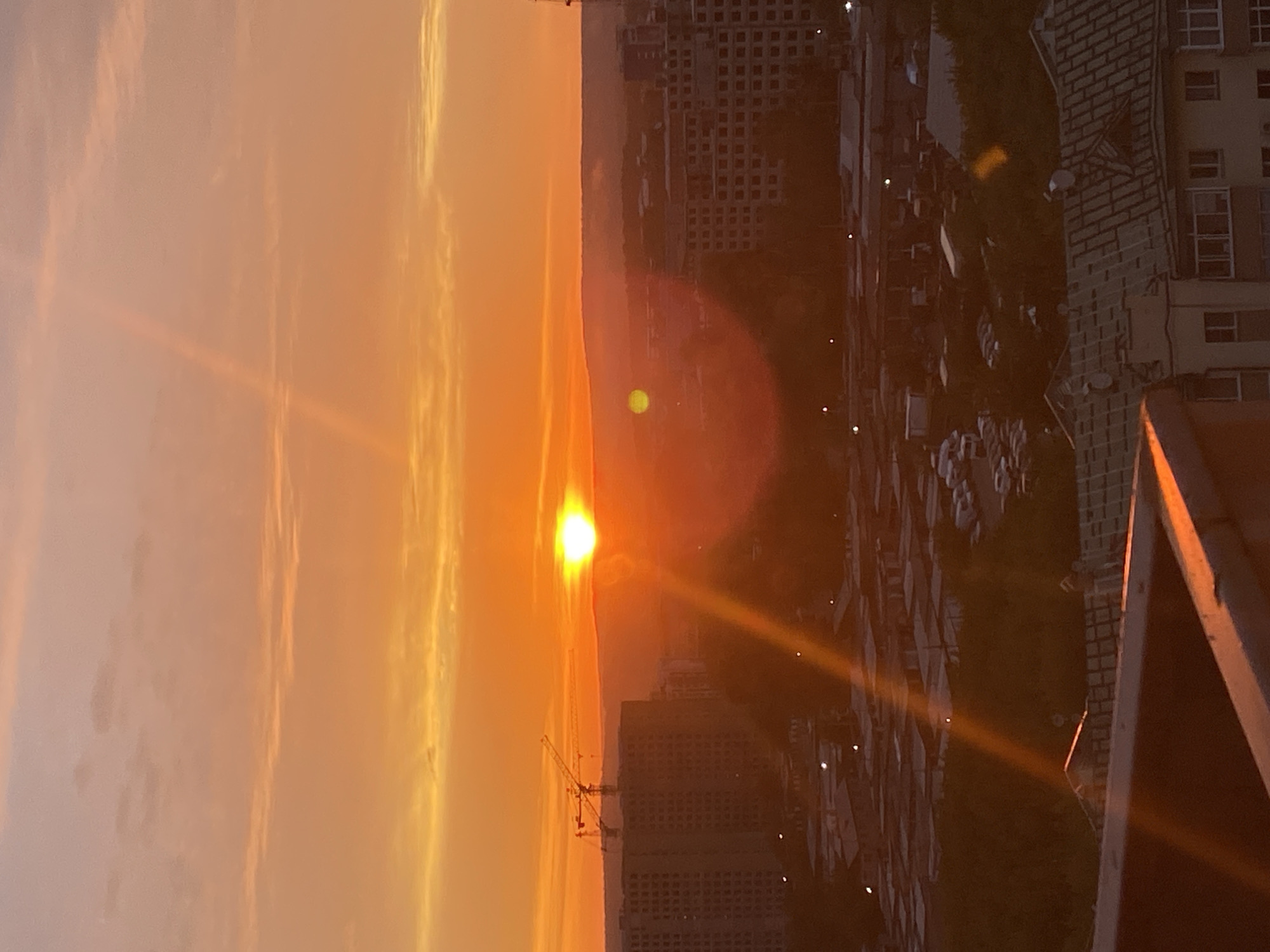 Warm sunset over Irkutsk, sky lit orange and pink