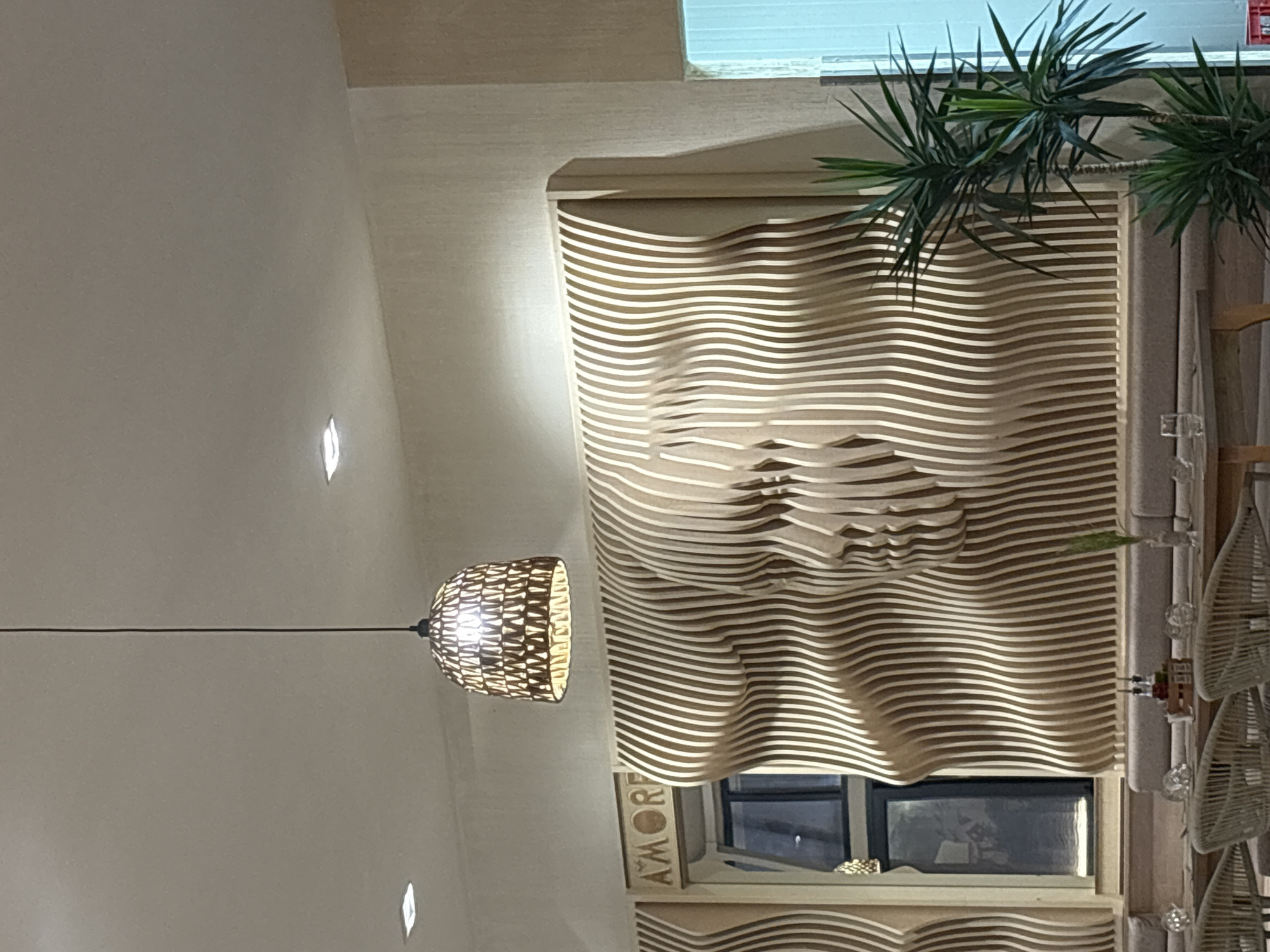 Beachside restaurant with wooden slat face sculptures and coastal decor