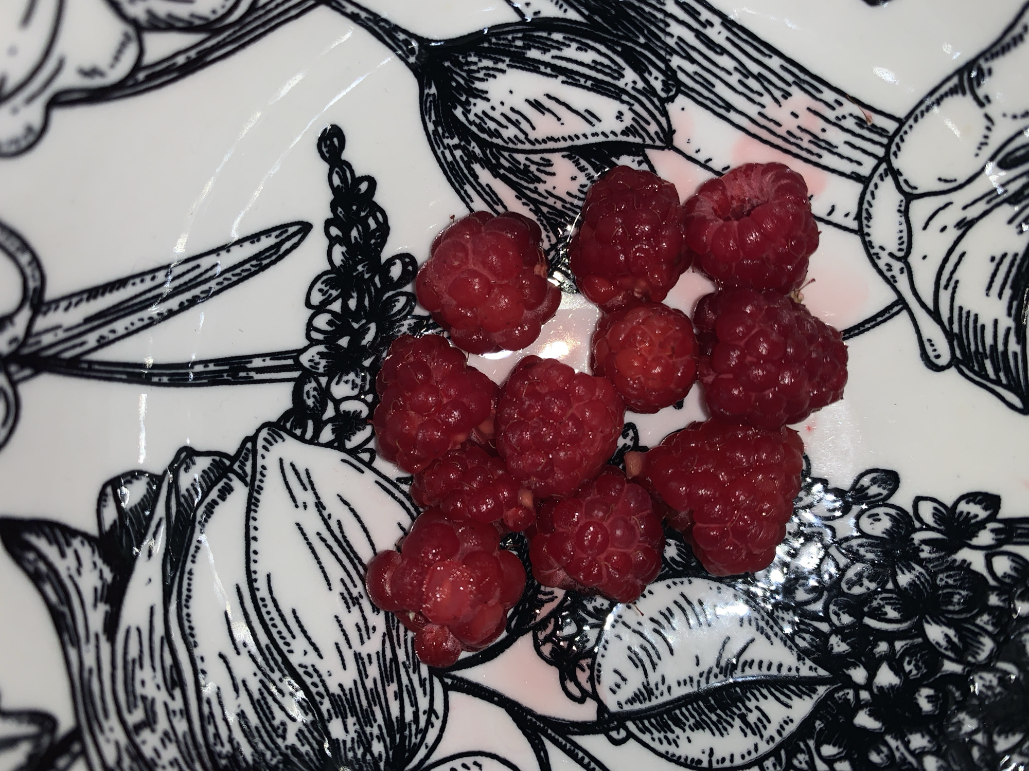 Raspberries and seedlings hint at a home growing setup